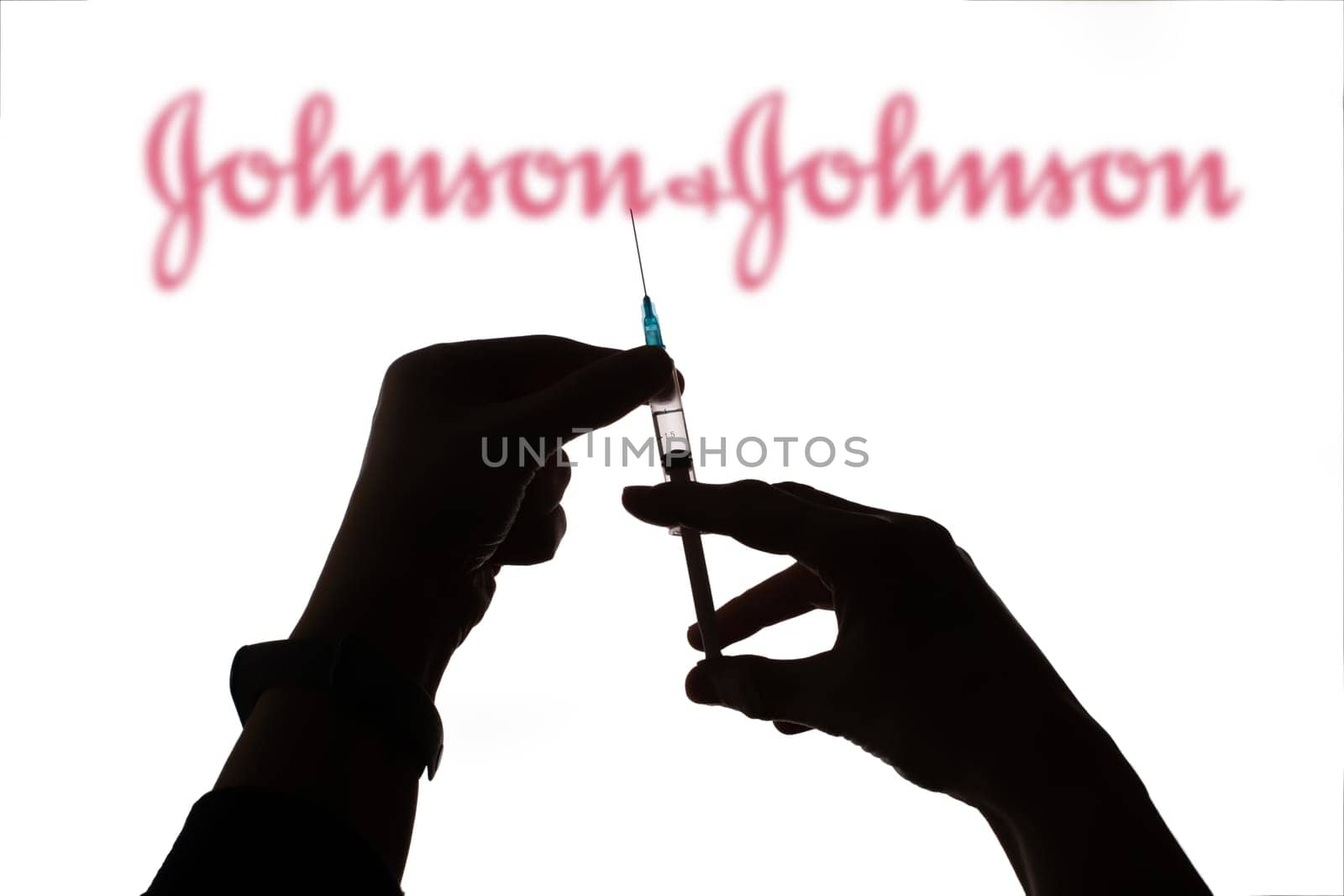 Cluj-Napoca, Romania - March 15, 2021:  New coronavirus vaccine Johnson and Johnson  concept, blurred Johnson and Johnson logo on the background. Covid-19, 2019-nCov pandemic.