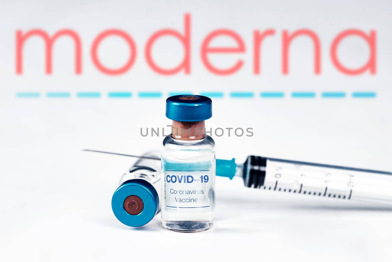 Cluj-Napoca, Romania - March 15, 2021:  New coronavirus vaccine Moderna concept, blurred Moderna logo on the background. Covid-19, 2019-nCov pandemic.
