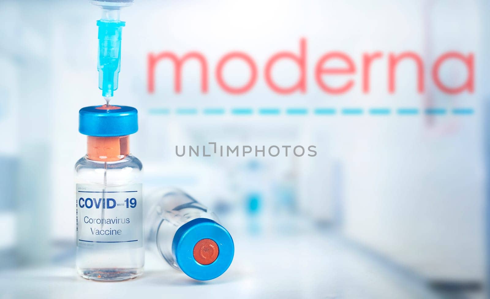 Cluj-Napoca, Romania - March 15, 2021:  New coronavirus vaccine Moderna concept, blurred Moderna logo on the background. Covid-19, 2019-nCov pandemic.