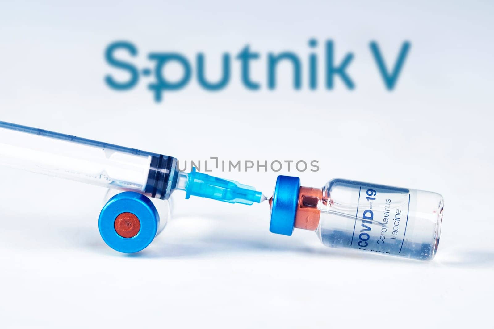Cluj-Napoca, Romania - March 15, 2021:  New coronavirus vaccine Sputnik V concept, blurred Sputnik V logo on the background. Covid-19, 2019-nCov pandemic.