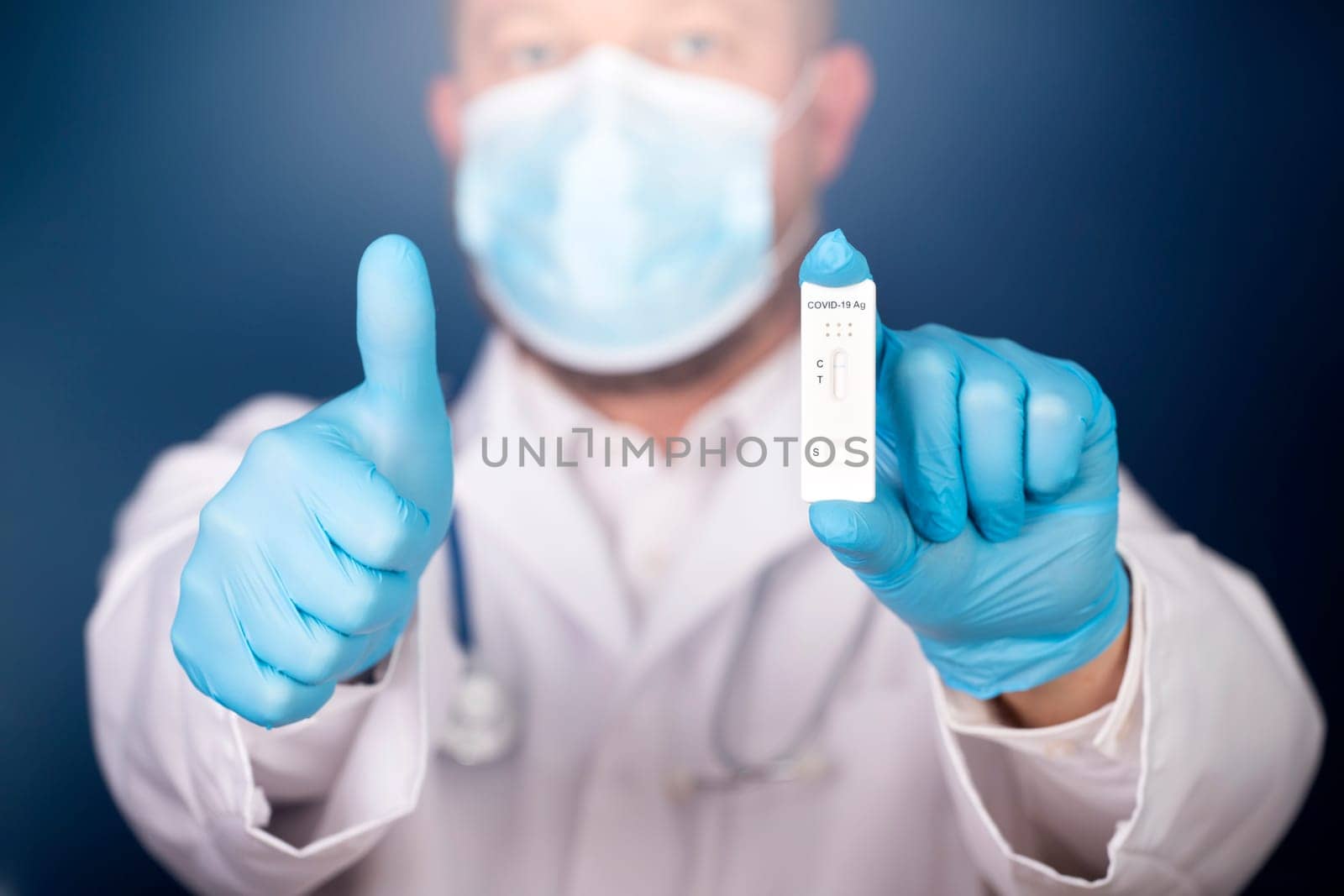 Doctor holding a test kit for viral disease COVID-19. Lab card kit tested NEGATIVE for viral novel coronavirus sars-cov-2 virus.