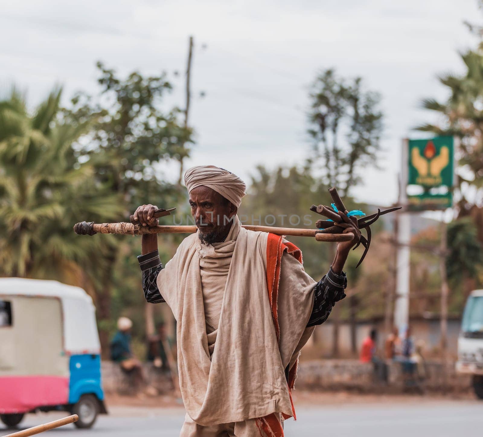 Adis Zemen, Ethiopia - April 22, 2019: Old ethiopian farmer on the street of Adis Zemen, Ethiopia, Africa