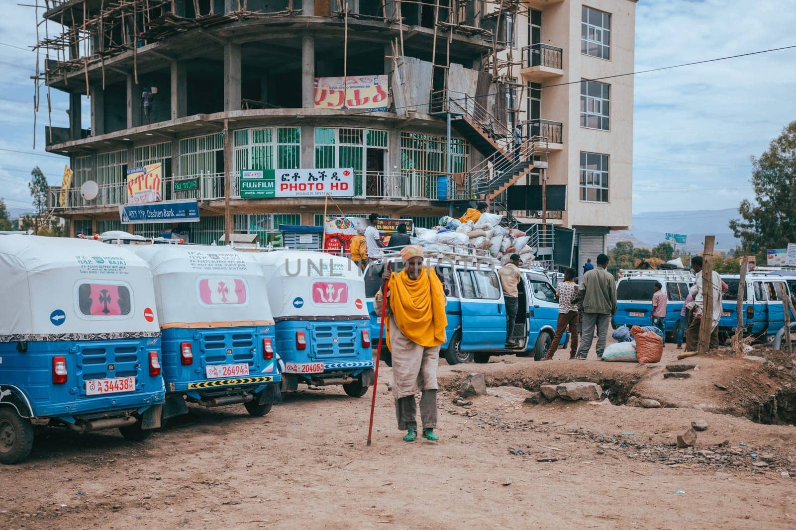 Azezo, Amhara Region, Ethiopia - April 22, 2019: Traditional means of transport in Ethiopia, blue color auto rickshaw known as Tuk tuk on street in city Azezo, Ethiopia, Africa