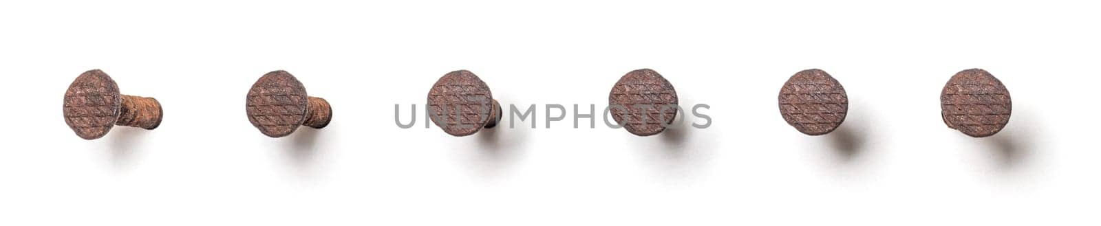 Rusty nail from different perspectives on a white background
