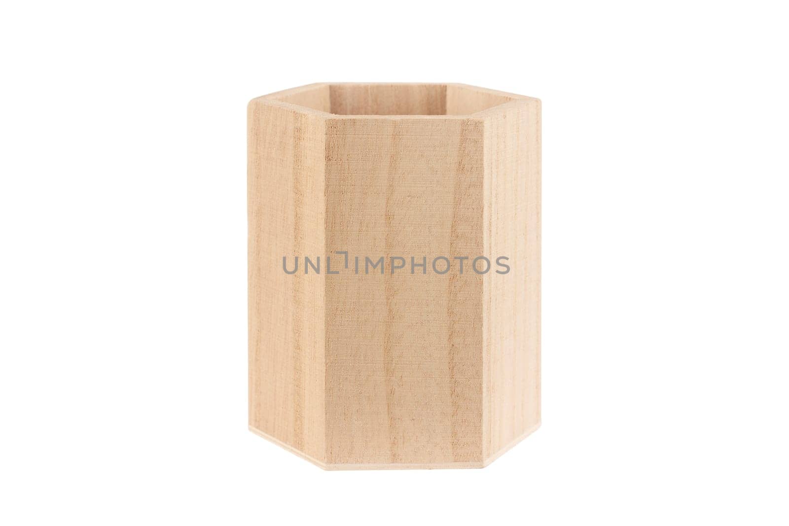front view closeup of empty wooden hexagonal pencil desk holder isolated on white background