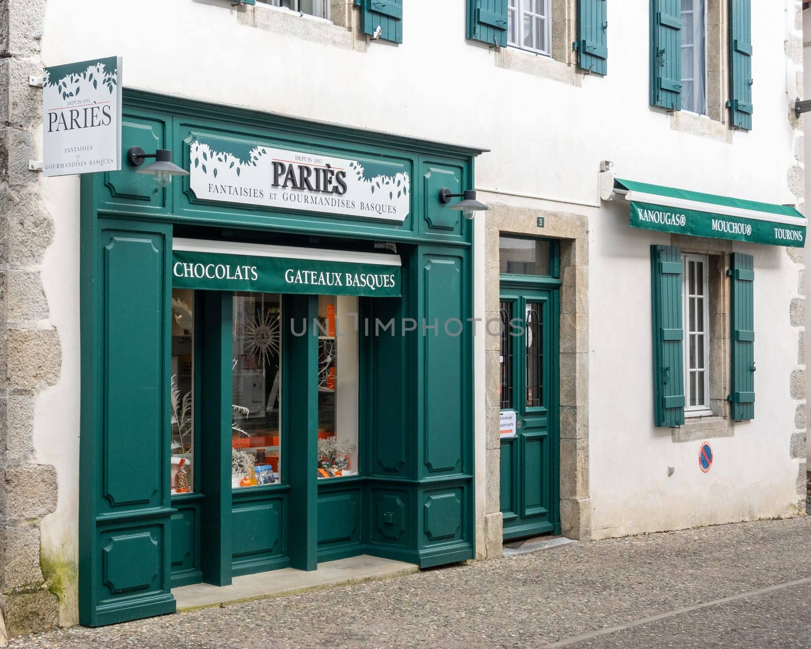 ESPELETTE, FRANCE - CIRCA FEBRUARY 2021: Paries shop facade. Paries is a chocolate, pastry, ice cream and confectionery maker from the French Basque Country.