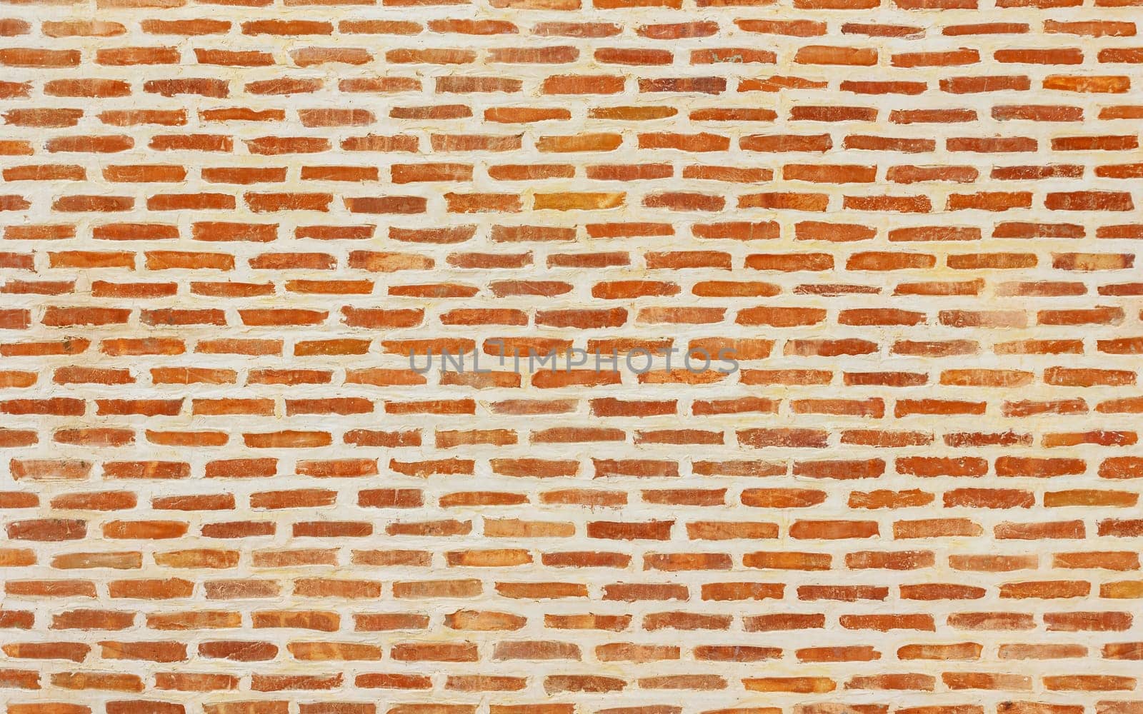 Beautiful brick wall texture with white cement joints, brick background