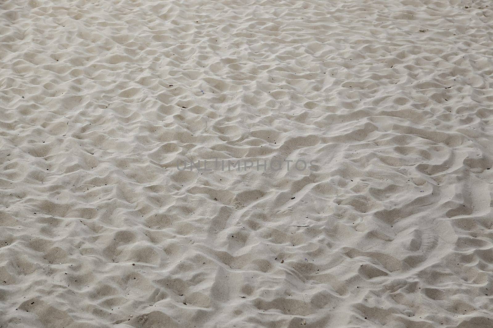 Sand detail on a beach in summer, tourism and nature, vacation