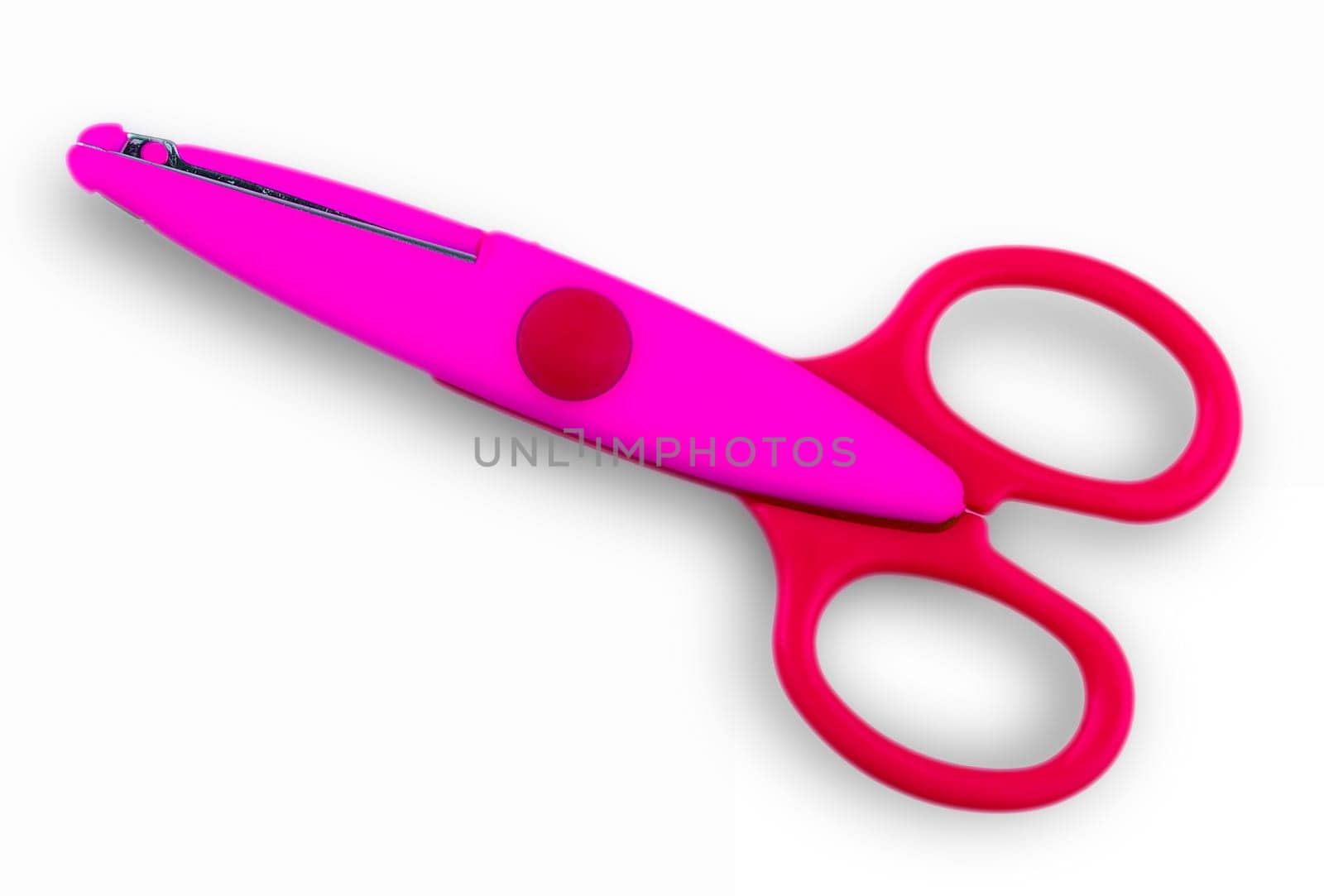 The Colore baby scissors cut out on a white background. View from above