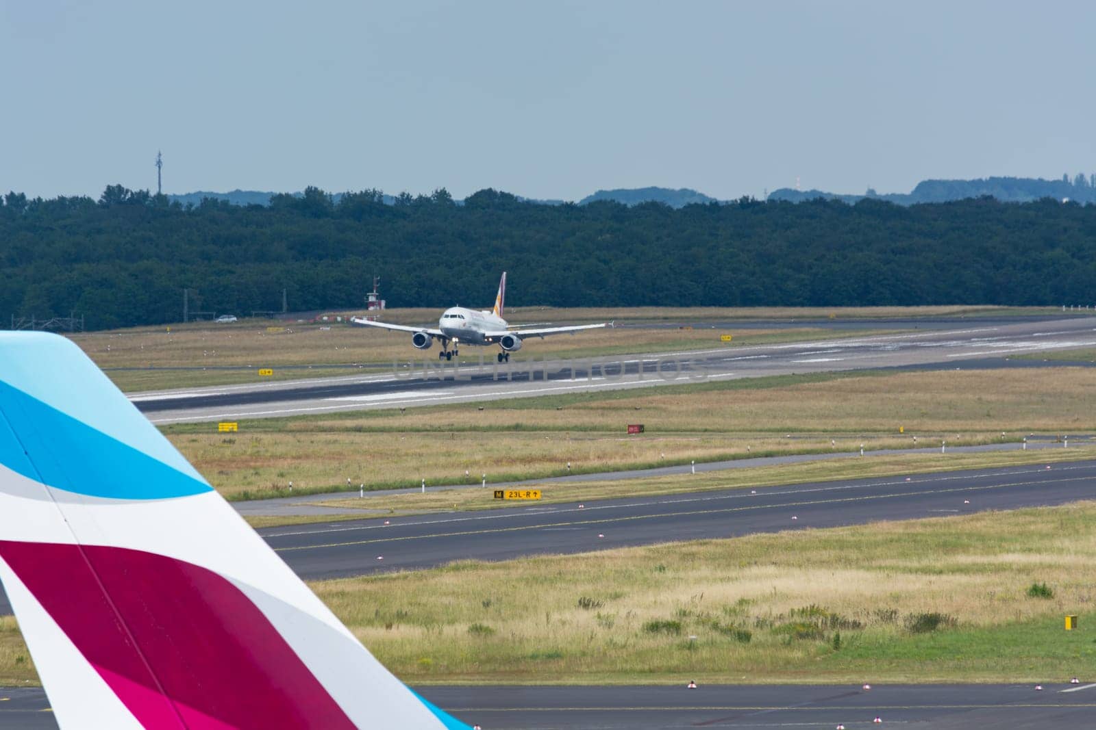 DUESSELDORF, NRW, GERMANY - JUNE 18, 2019:.Eurowing plane lands at Dusseldorf International Airport.