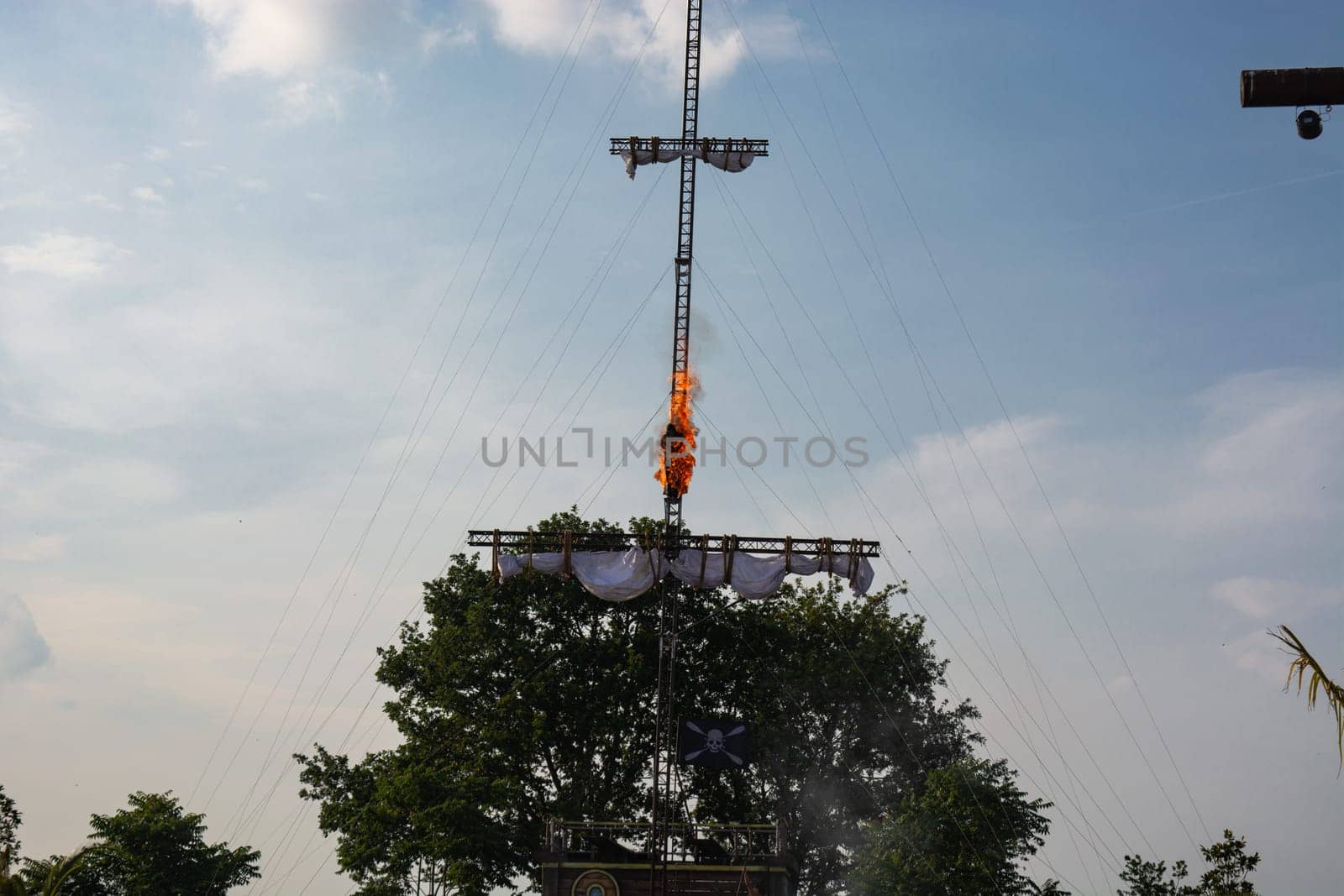 SEVENUM, LIMBURG, NETHERLANDS - JULY 17, 2019: Amusement park show event of a pirate race. A man spring burning from a mast Holland, Europe.