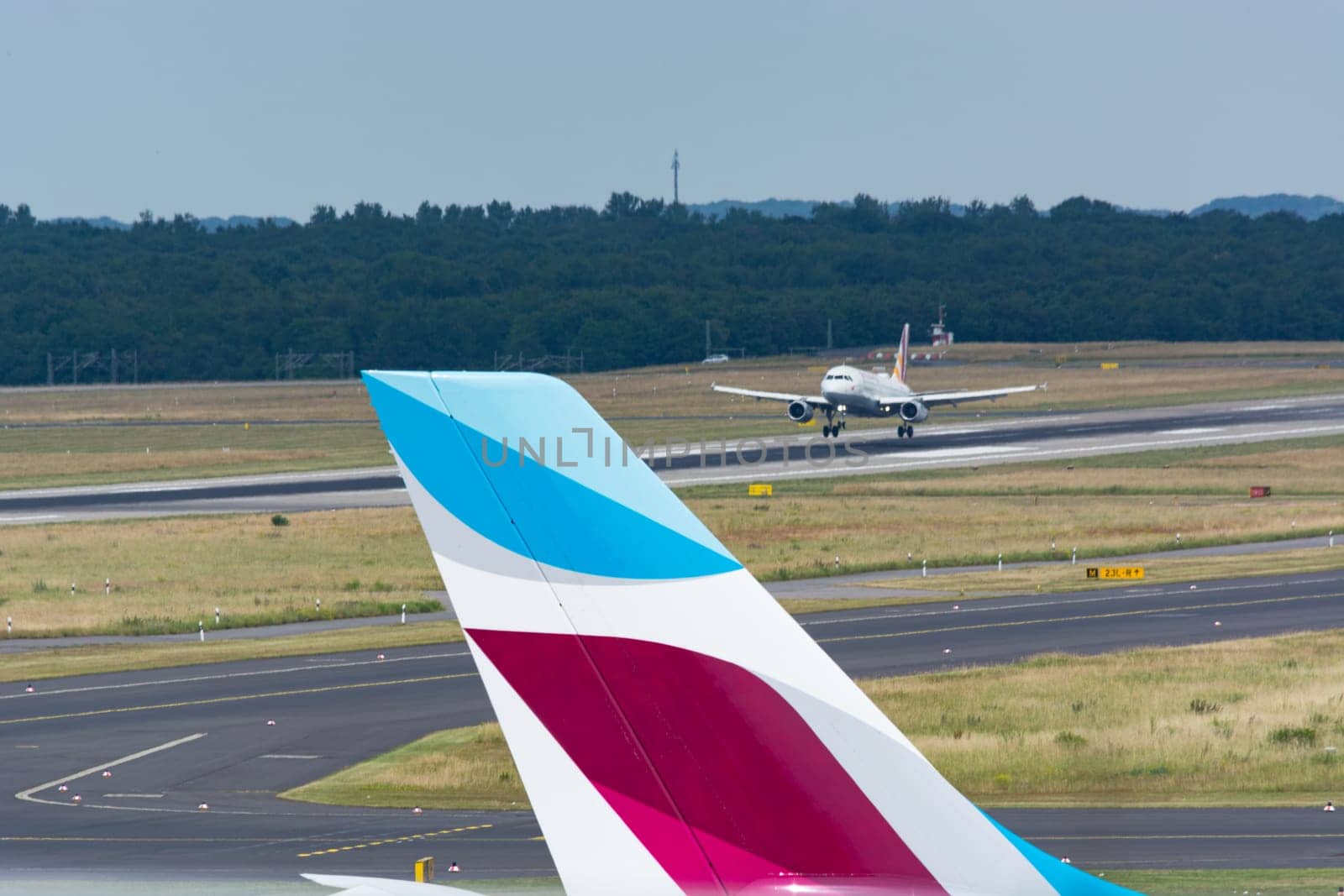 DUESSELDORF, NRW, GERMANY - JUNE 18, 2019:.Eurowing plane lands at Dusseldorf International Airport.