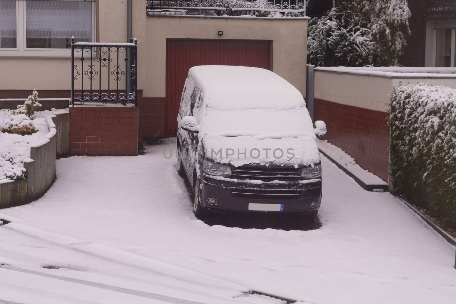 The car in the snow, covered with a white drift of snow.