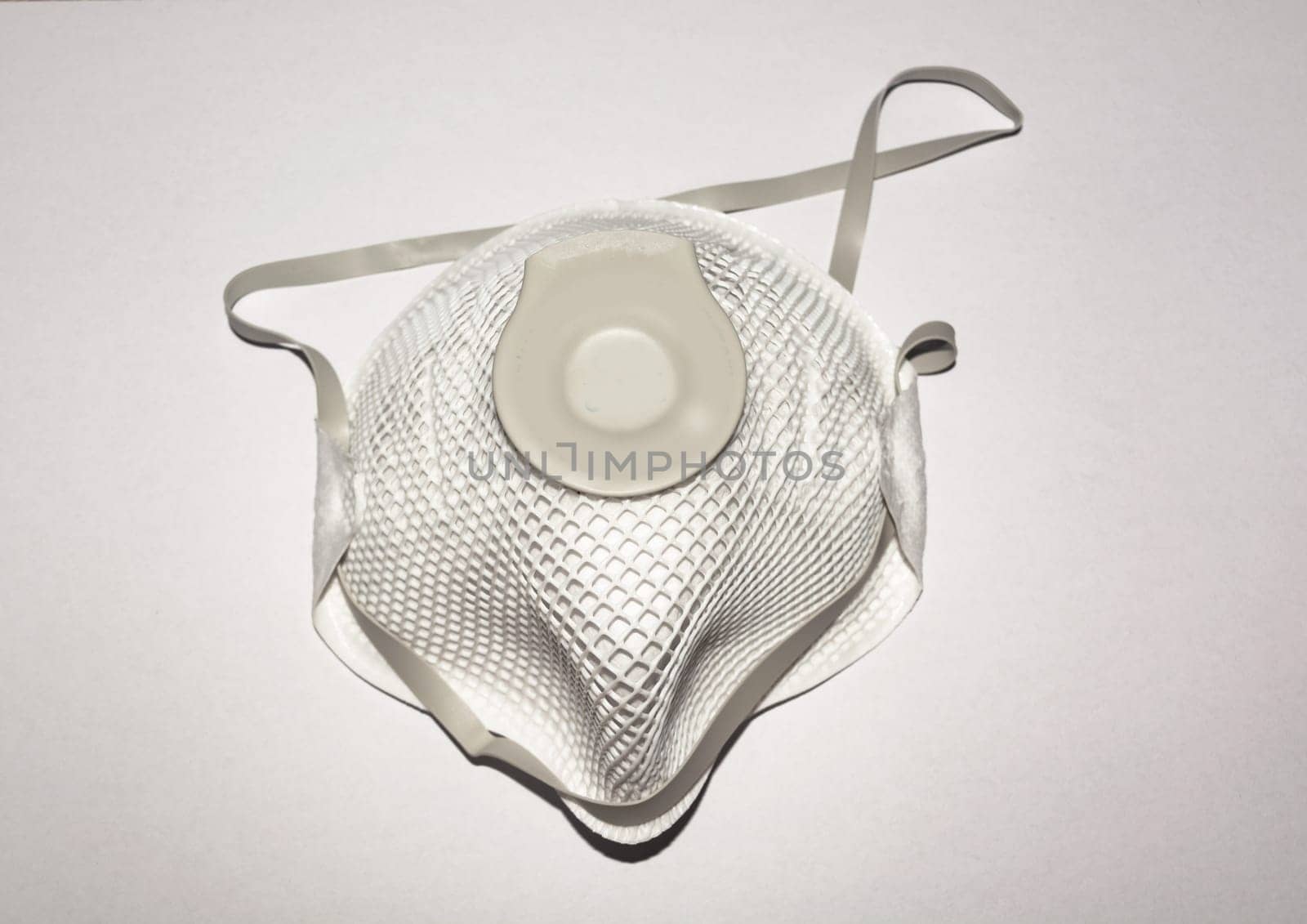 View of Disposable Respirator Mask FFP3, FFP2. Protection against Covid-19, particles, gases. Fine dust medical mask FFP 3 with breathing valve