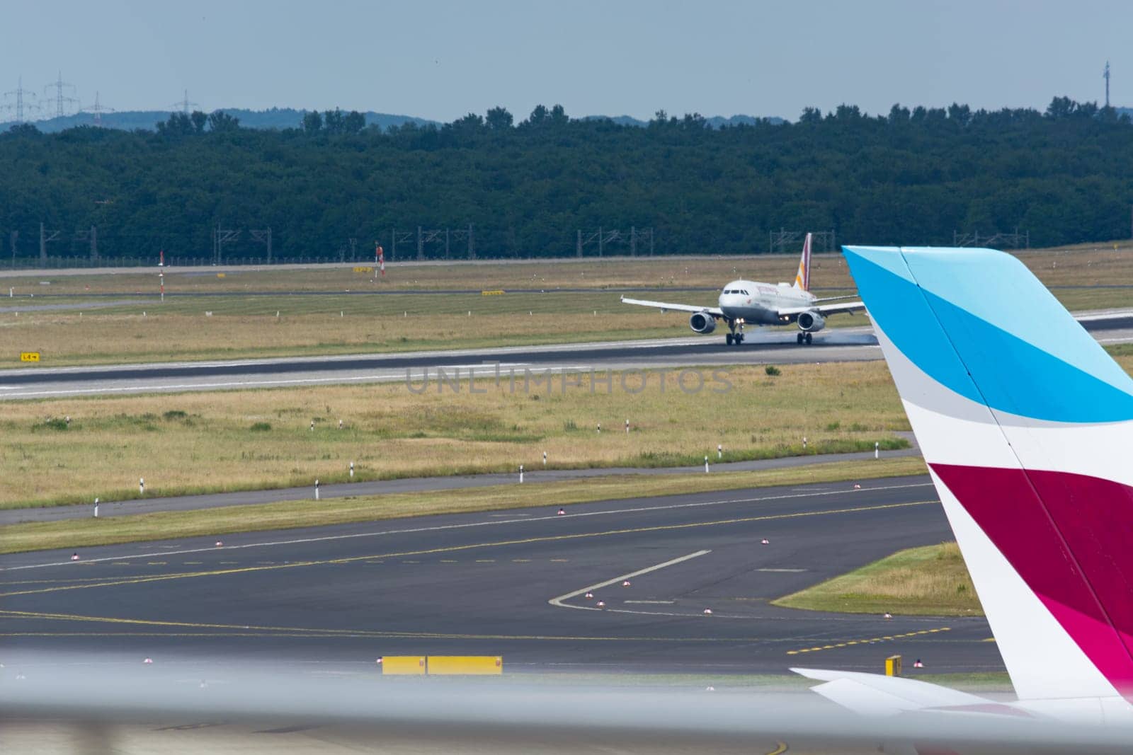 DUESSELDORF, NRW, GERMANY - JUNE 18, 2019:.Eurowing plane lands at Dusseldorf International Airport.