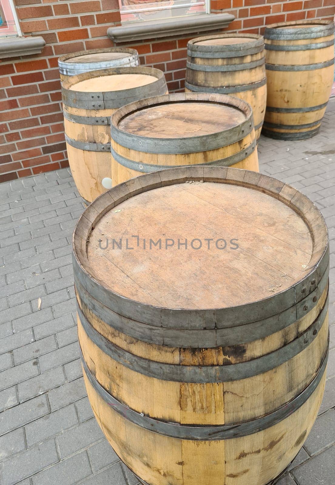 Detail view of stacked whisky and wine wooden barrels