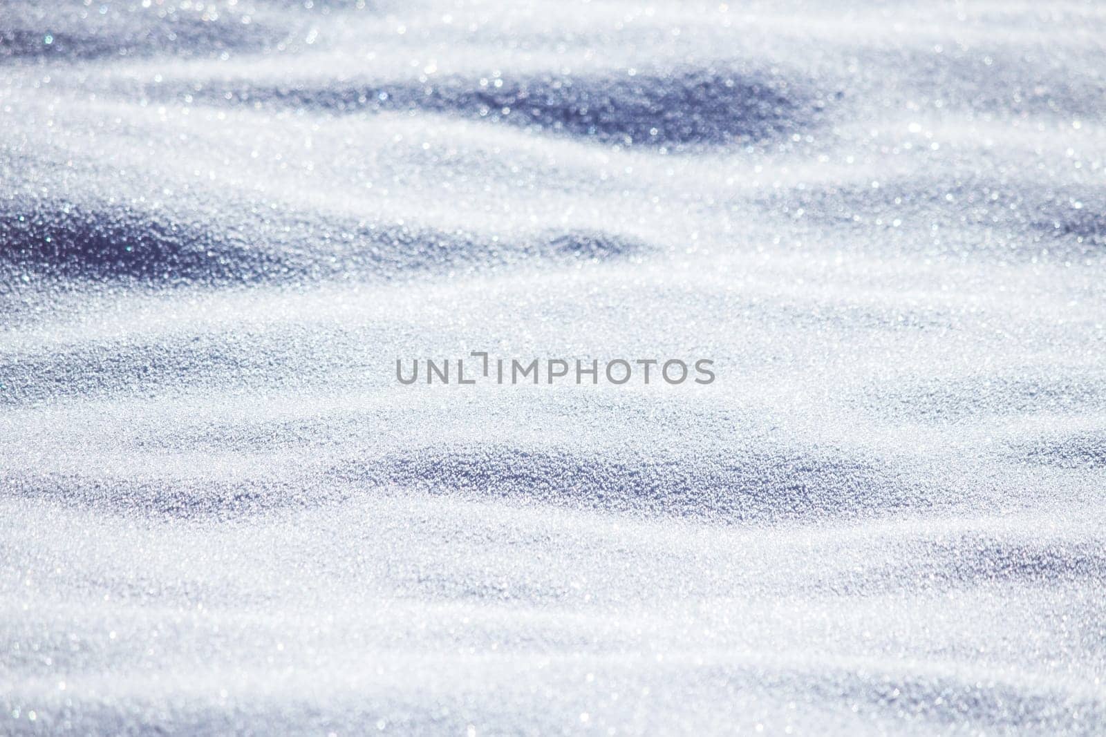 Close up of snow particles and flakes. Winter snow background