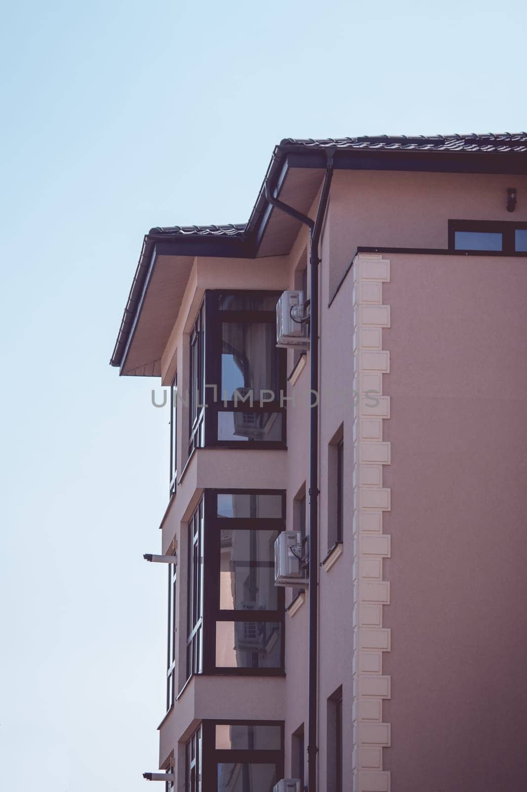 New apartment building with balcony and reflection window