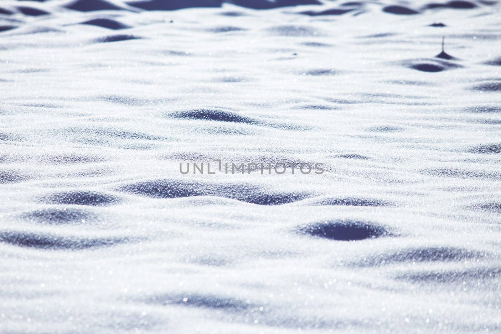 Close up of snow particles and flakes. Winter snow background