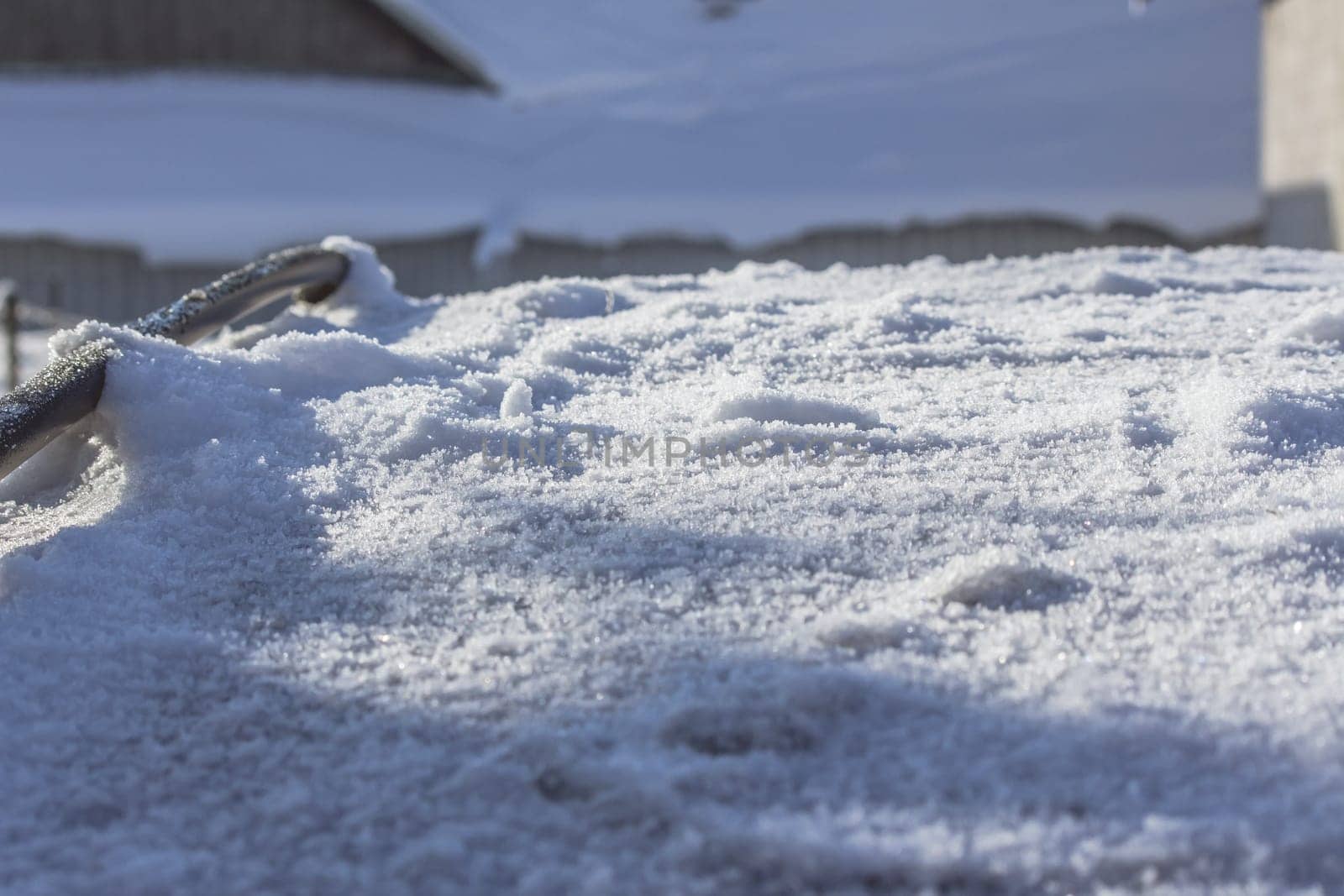 Close up of snow particles and flakes. Winter snow background