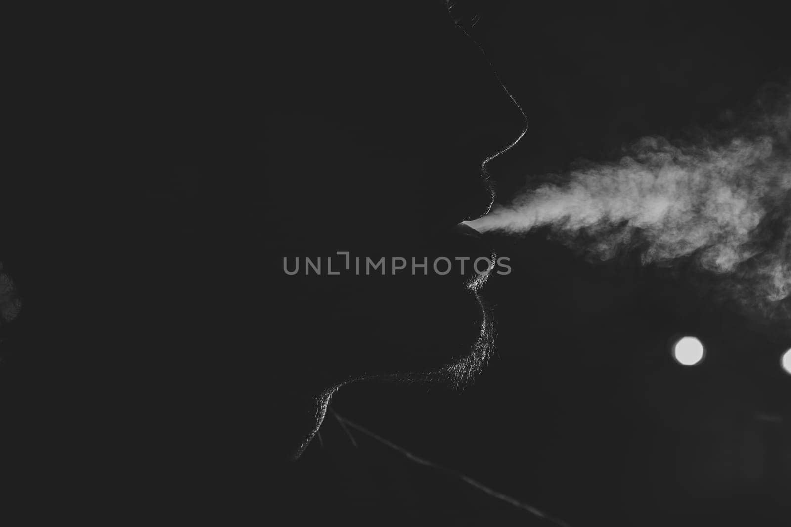Black and white old-fashioned portrait of man with cigar
