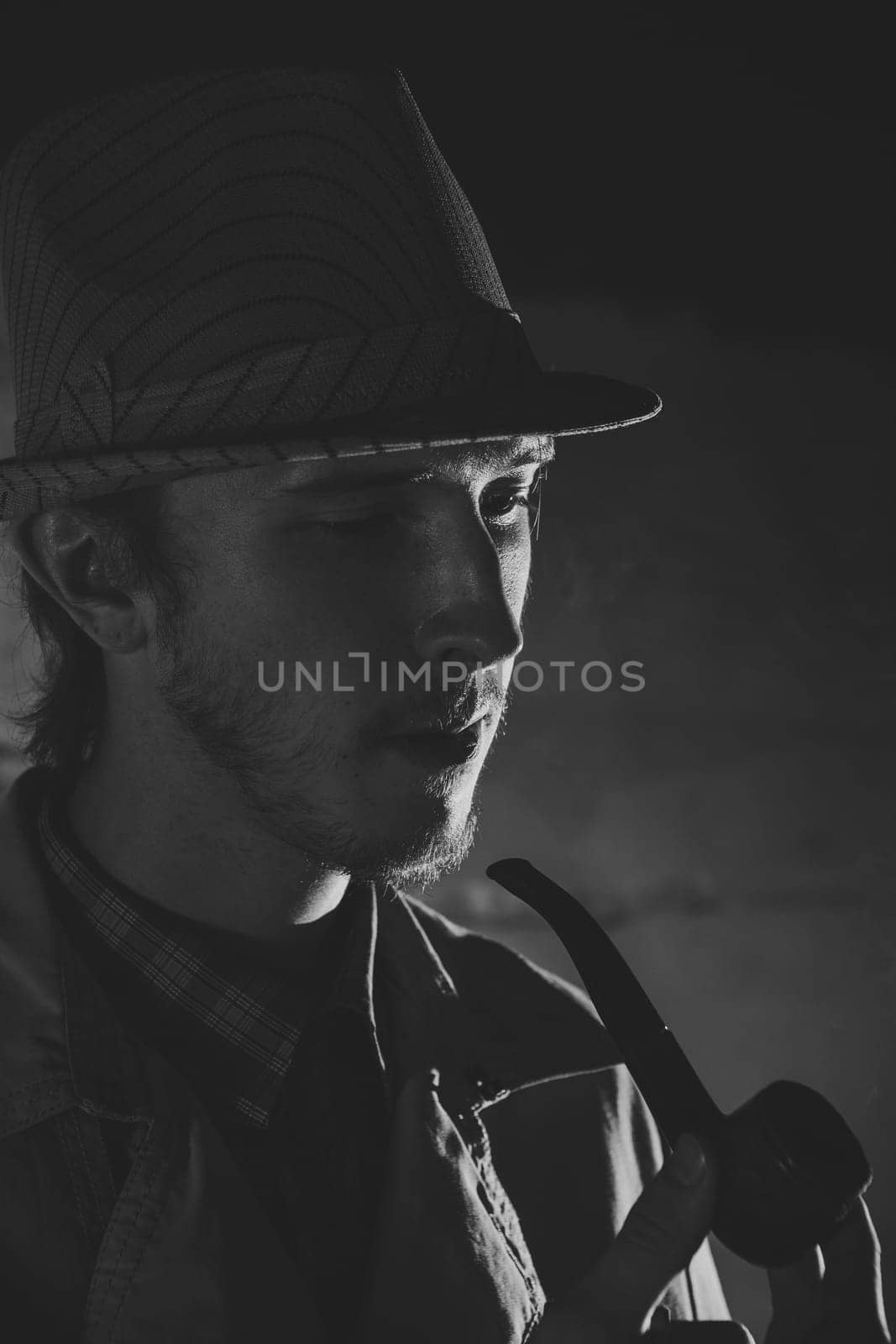 Black and white old-fashioned portrait of man with cigar