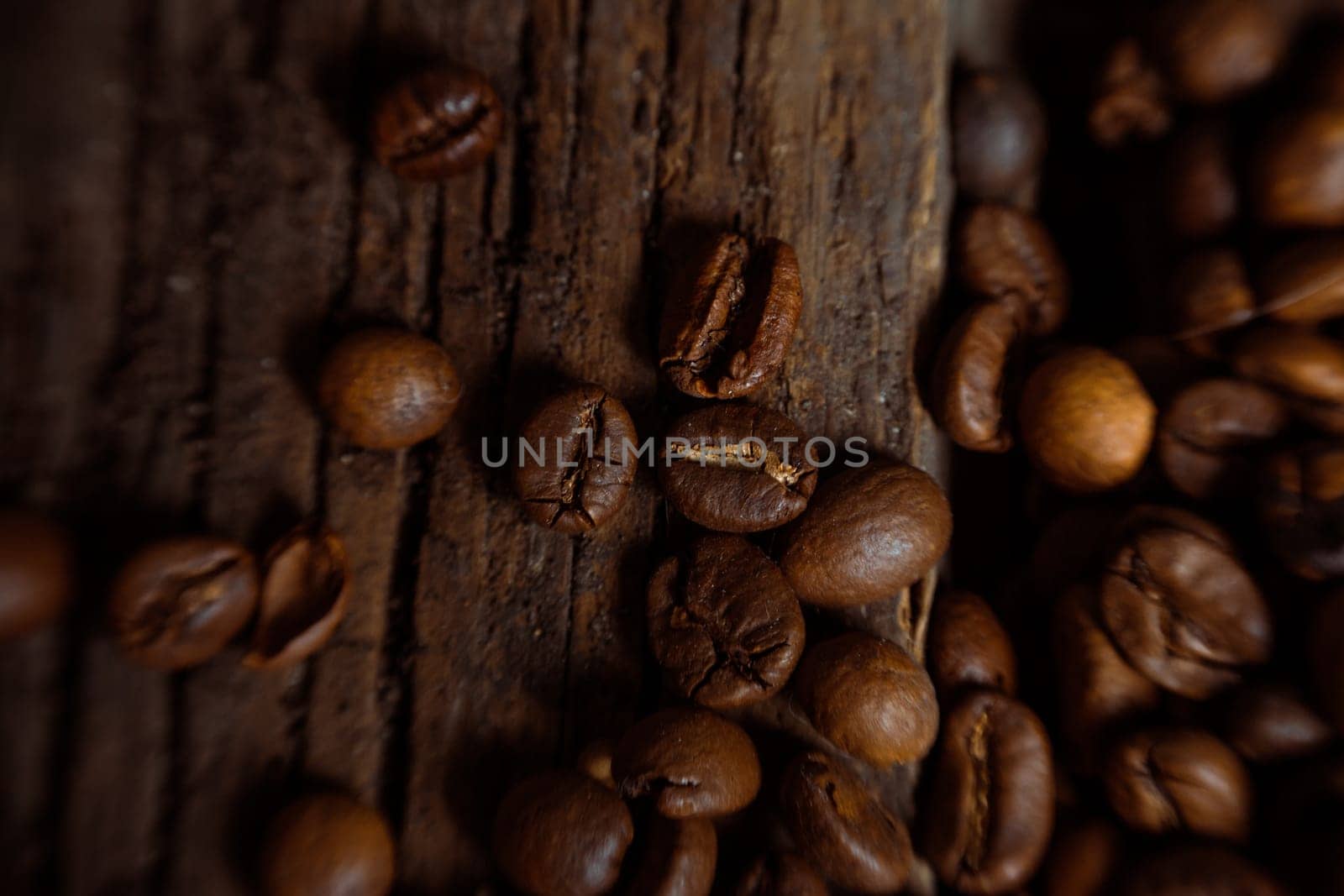Coffee on grunge wooden background Fresh coffee beans on wood and linen bag, ready to brew delicious coffee