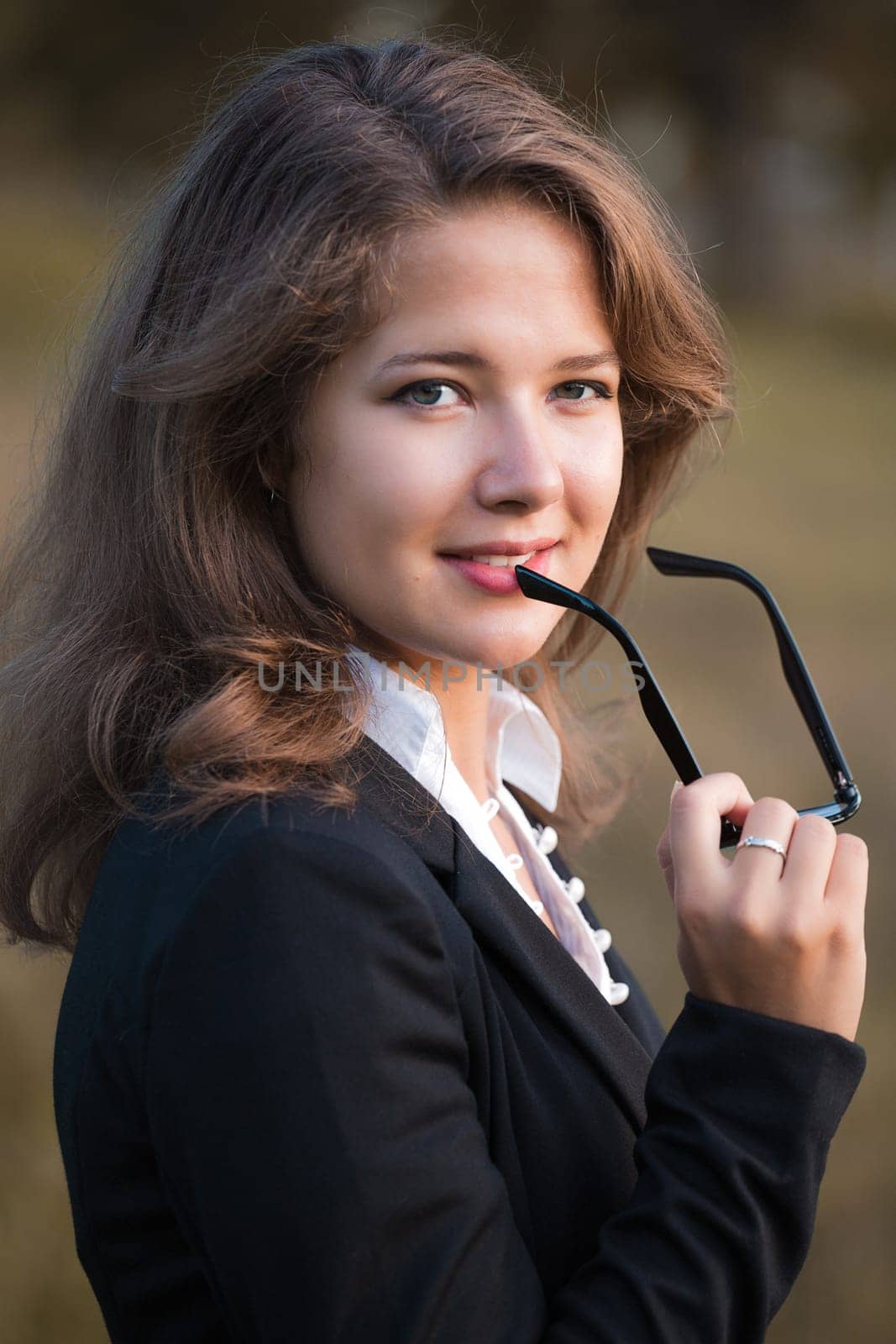 series. A portrait of the young business woman  in autumn park