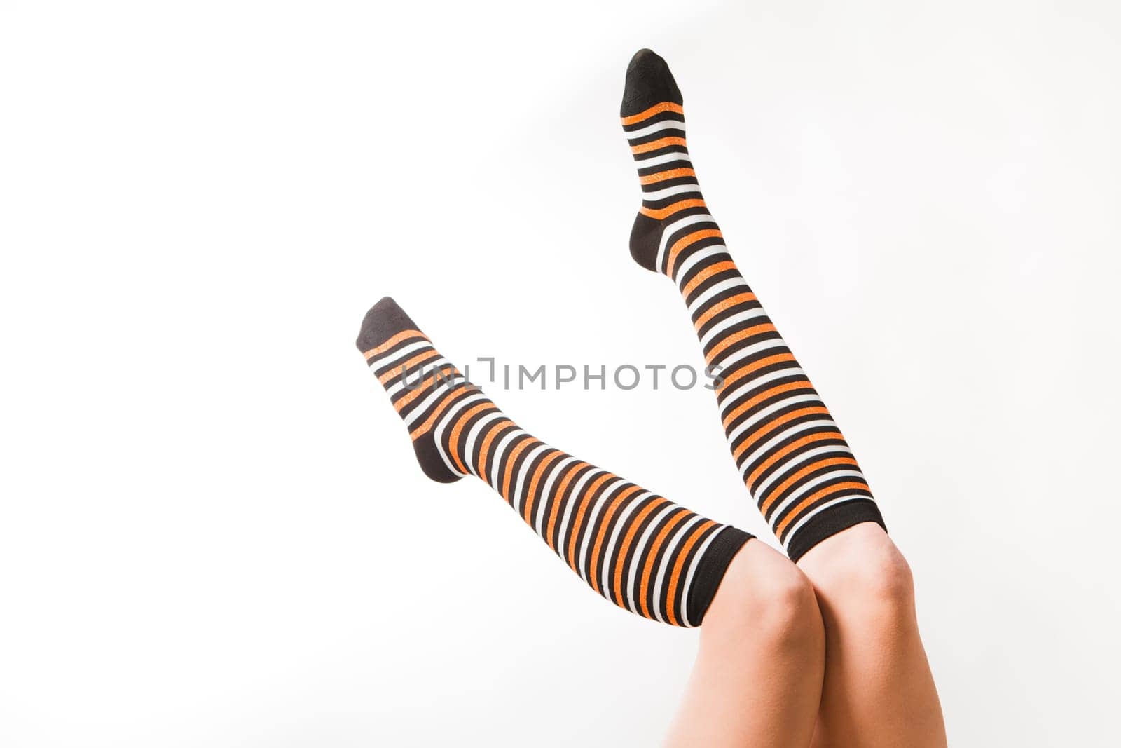 Pretty legs in a long multi-colored socks
