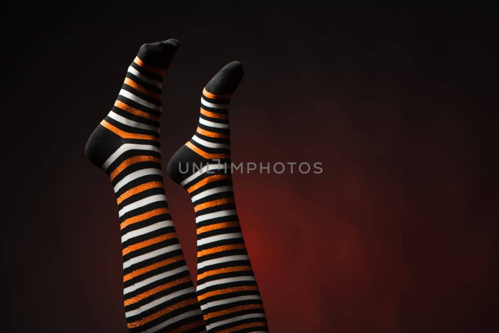 Pretty legs in a long multi-colored socks
