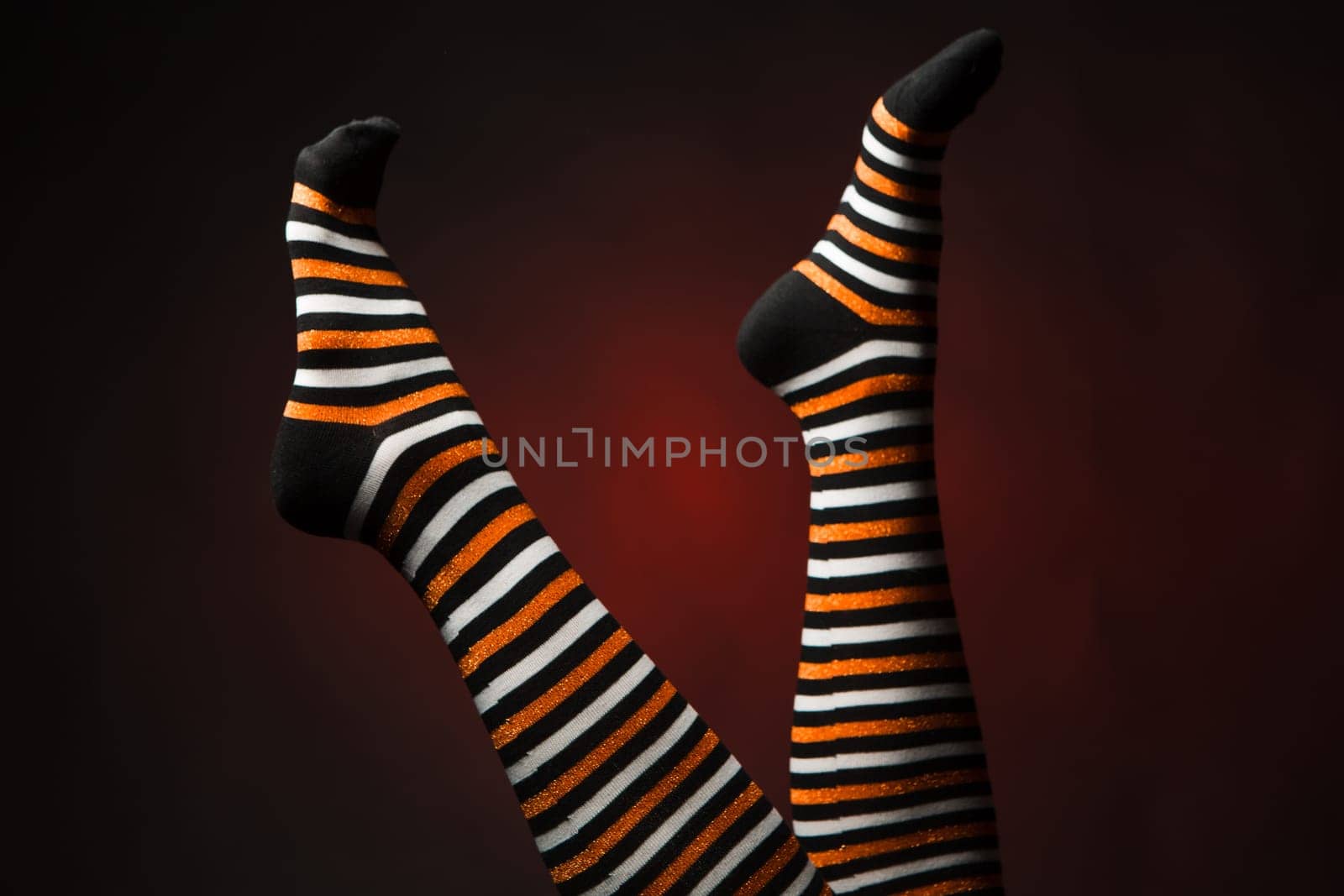 Pretty legs in a long multi-colored socks