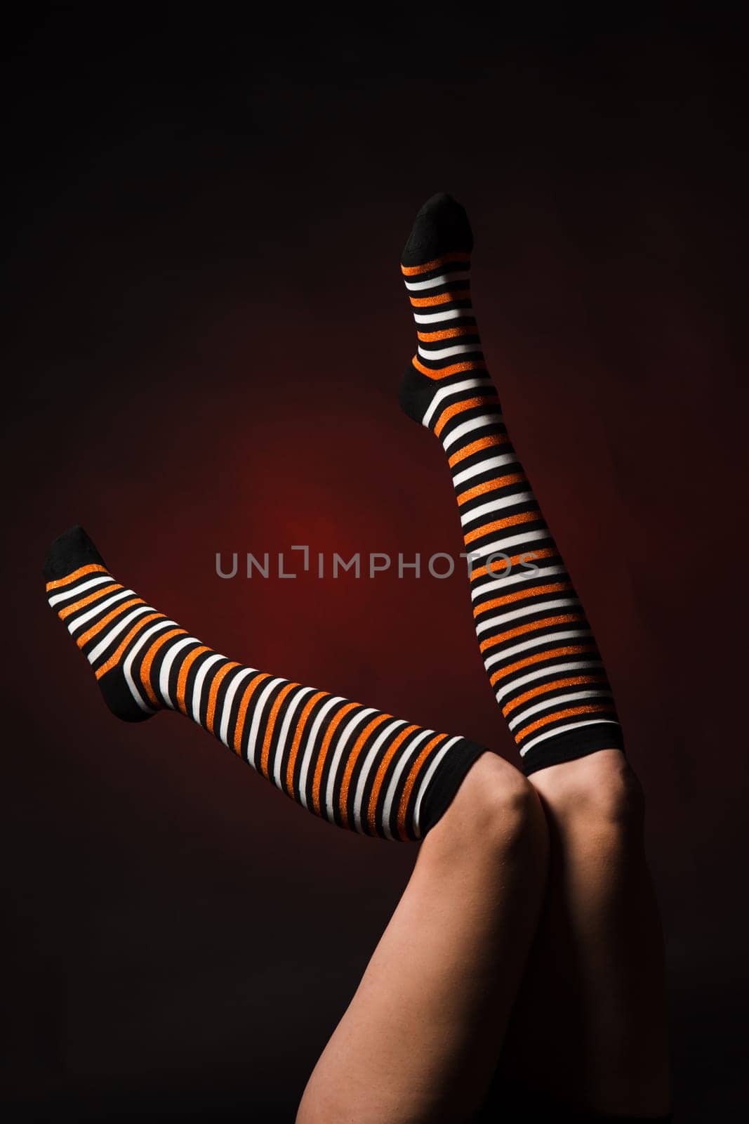 Pretty legs in a long multi-colored socks