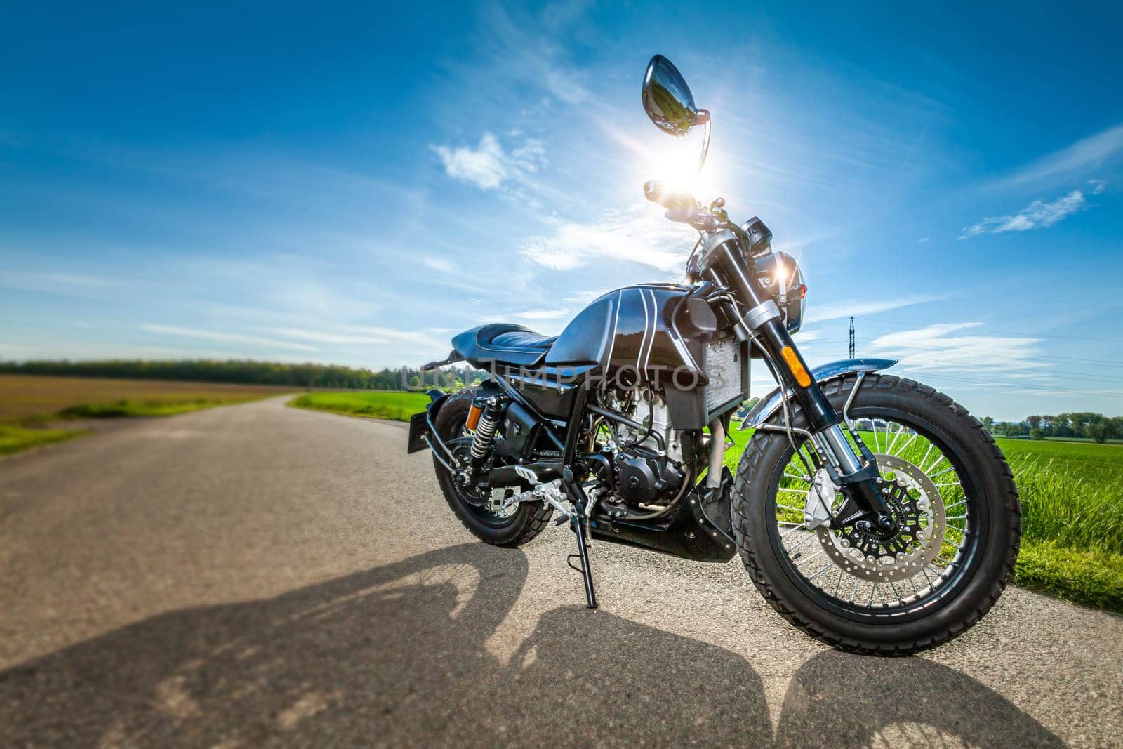 motorcycle in a sunny motorbike on the road riding. copyspace for your individual text. High quality photo