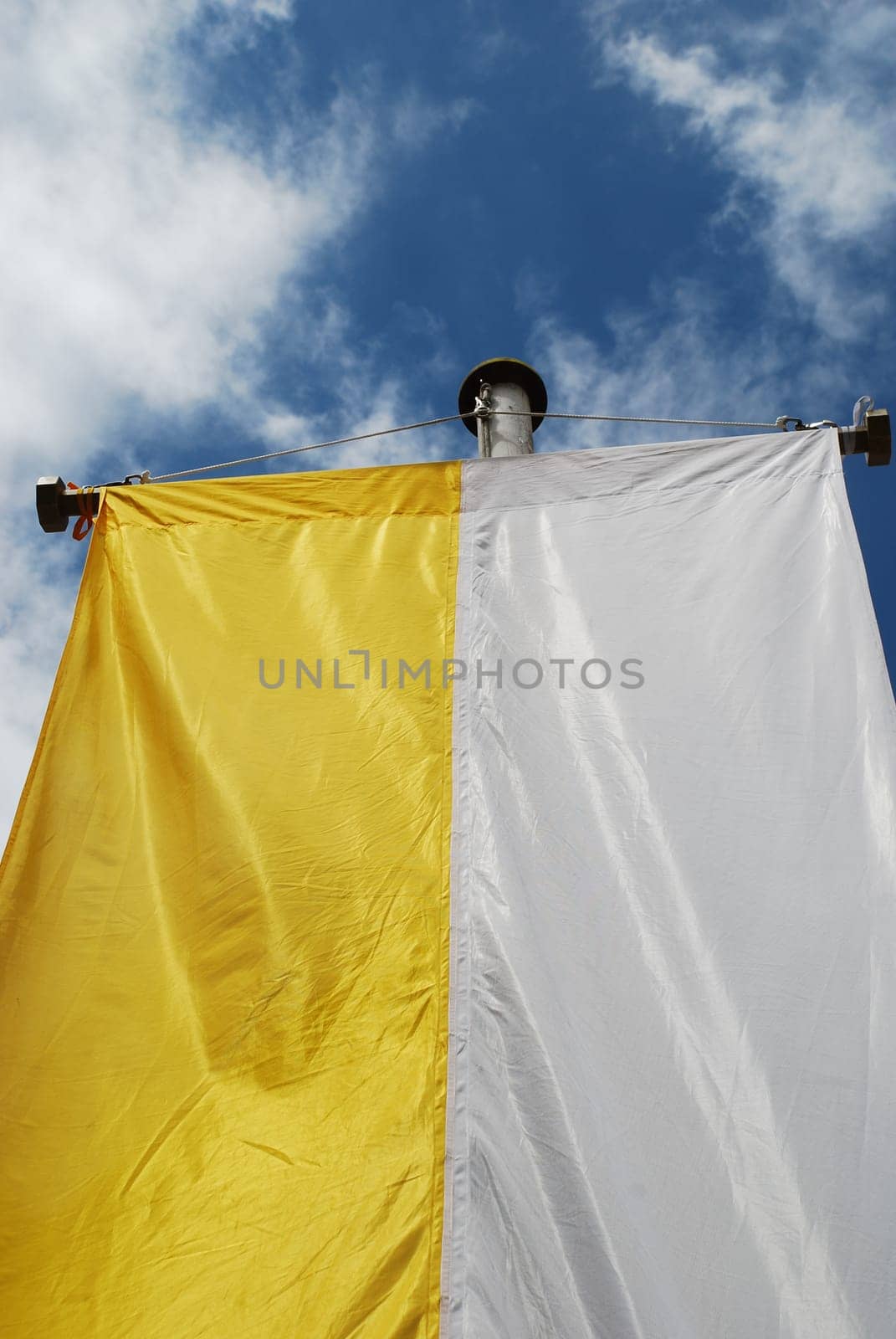The yellow and white church flag of the Catholic Church is hoisted on many festive days such as First Communion,Confirmation,Easter,Pentecost and Christmas.