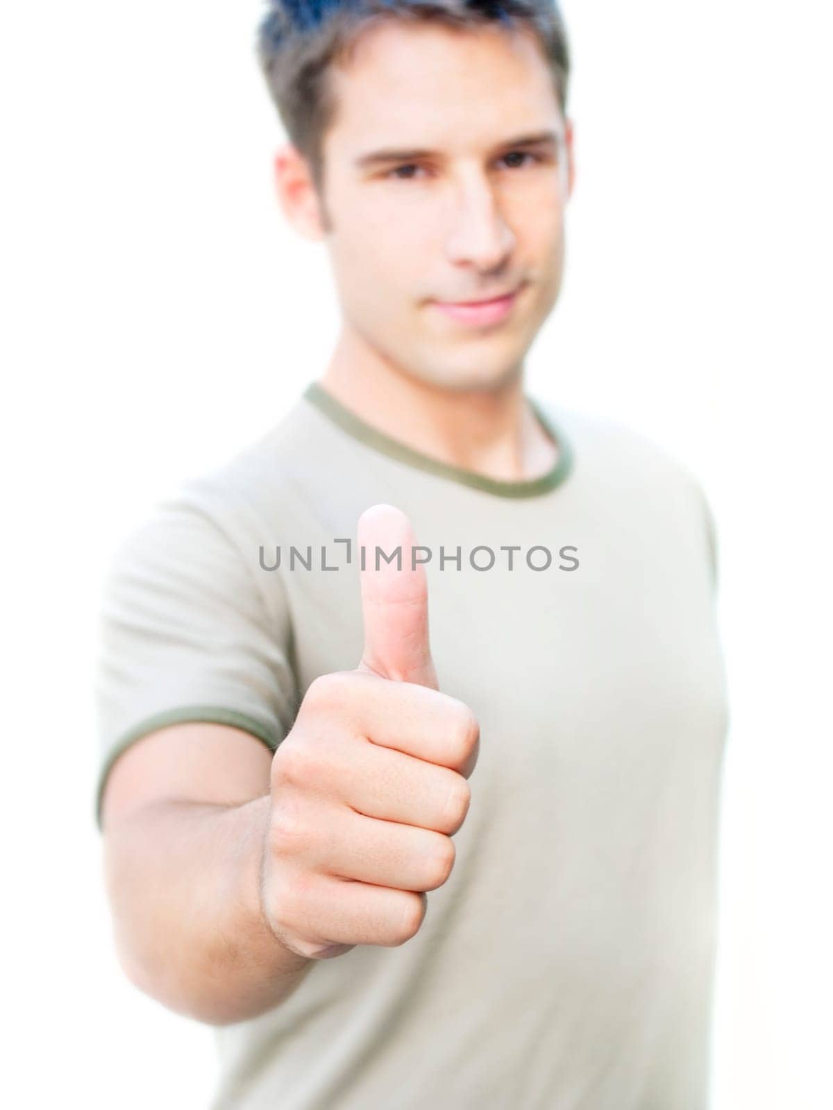 Young optimistic man showing his thumb up