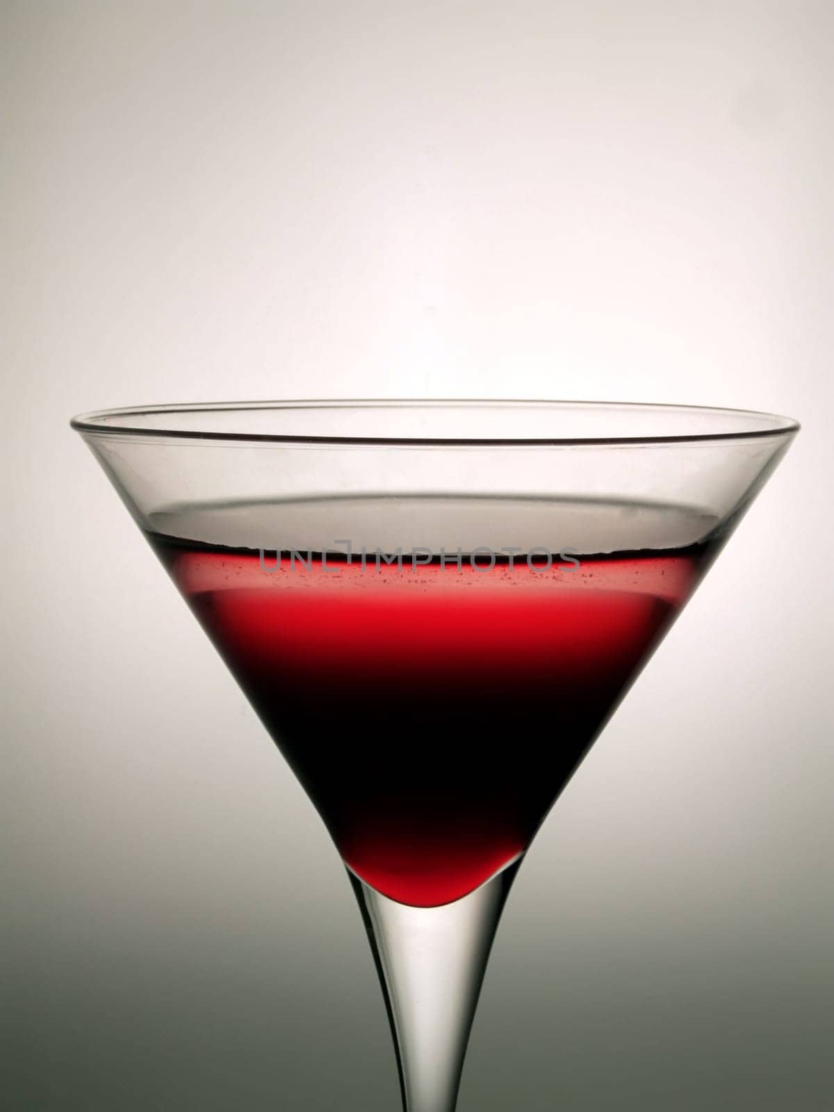 Cocktail glass with red beverage