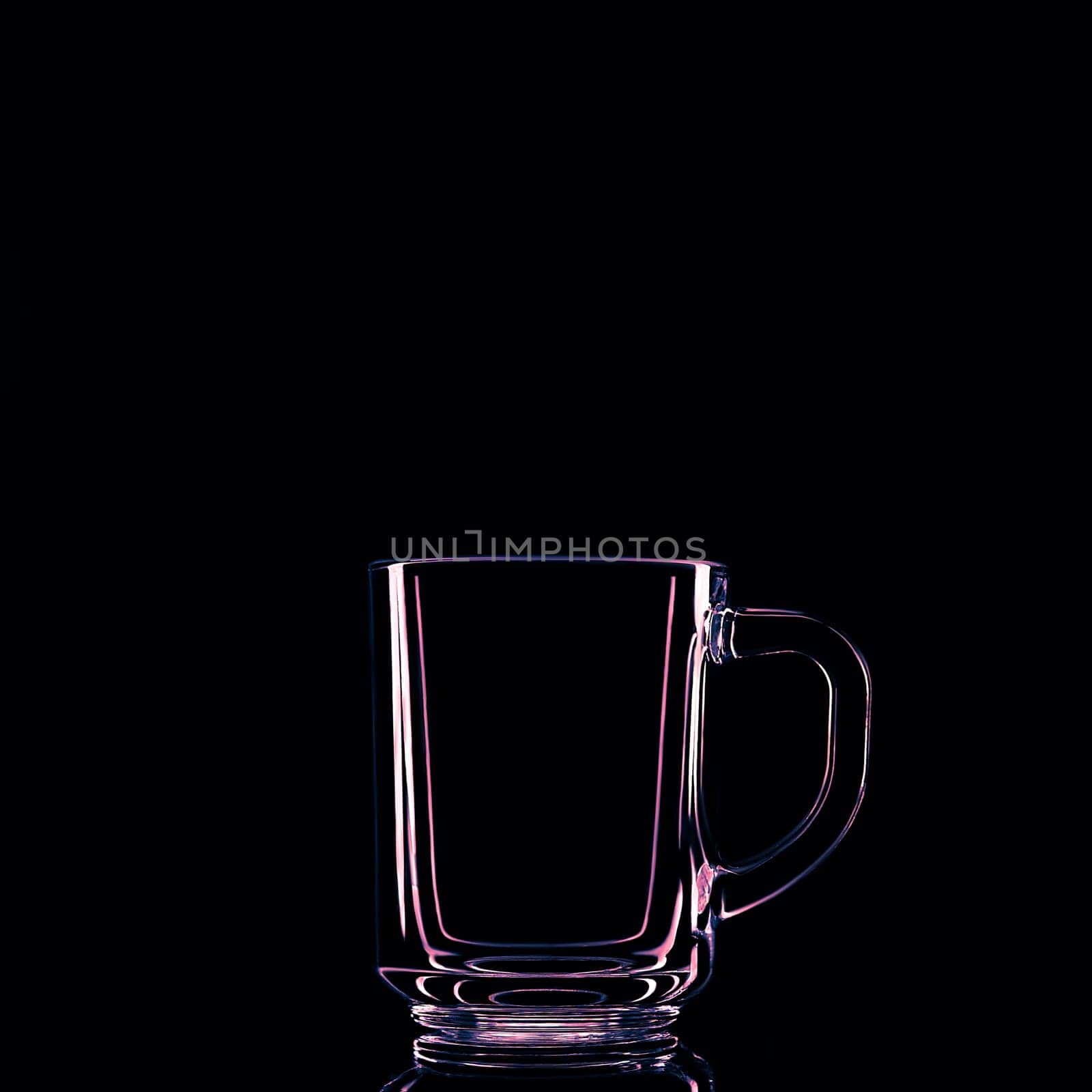 Just a glass on a black background with a reflection. Isolated.
