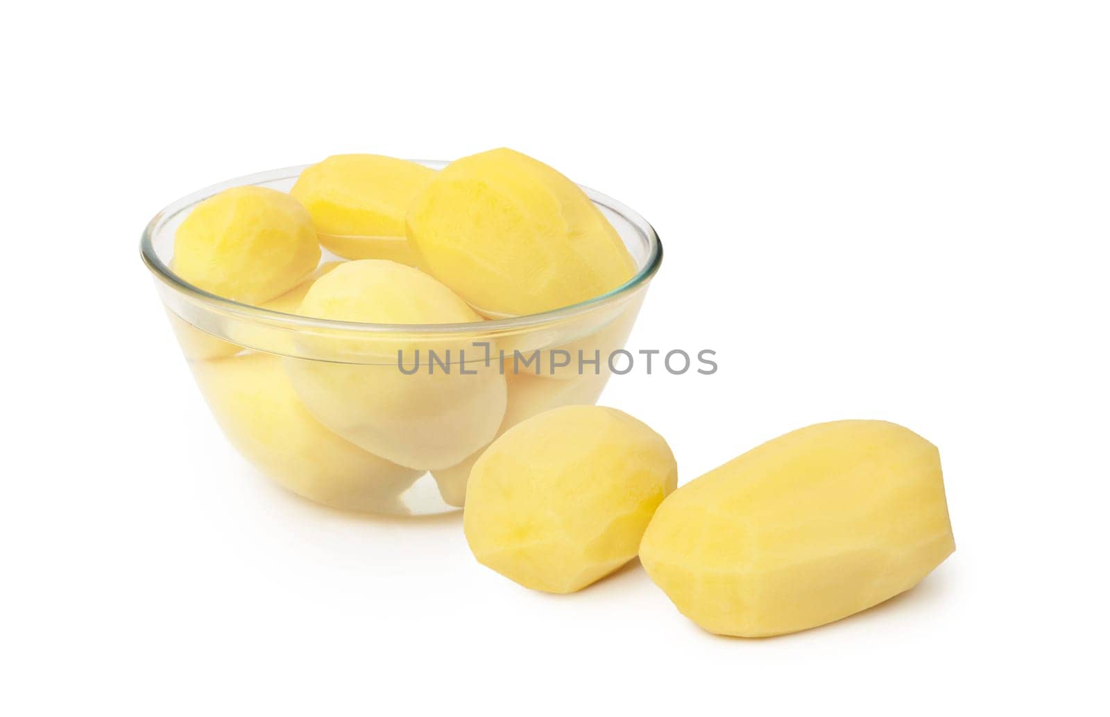Peeled potatoes in a glass bowl isolated on white background. With clippig path