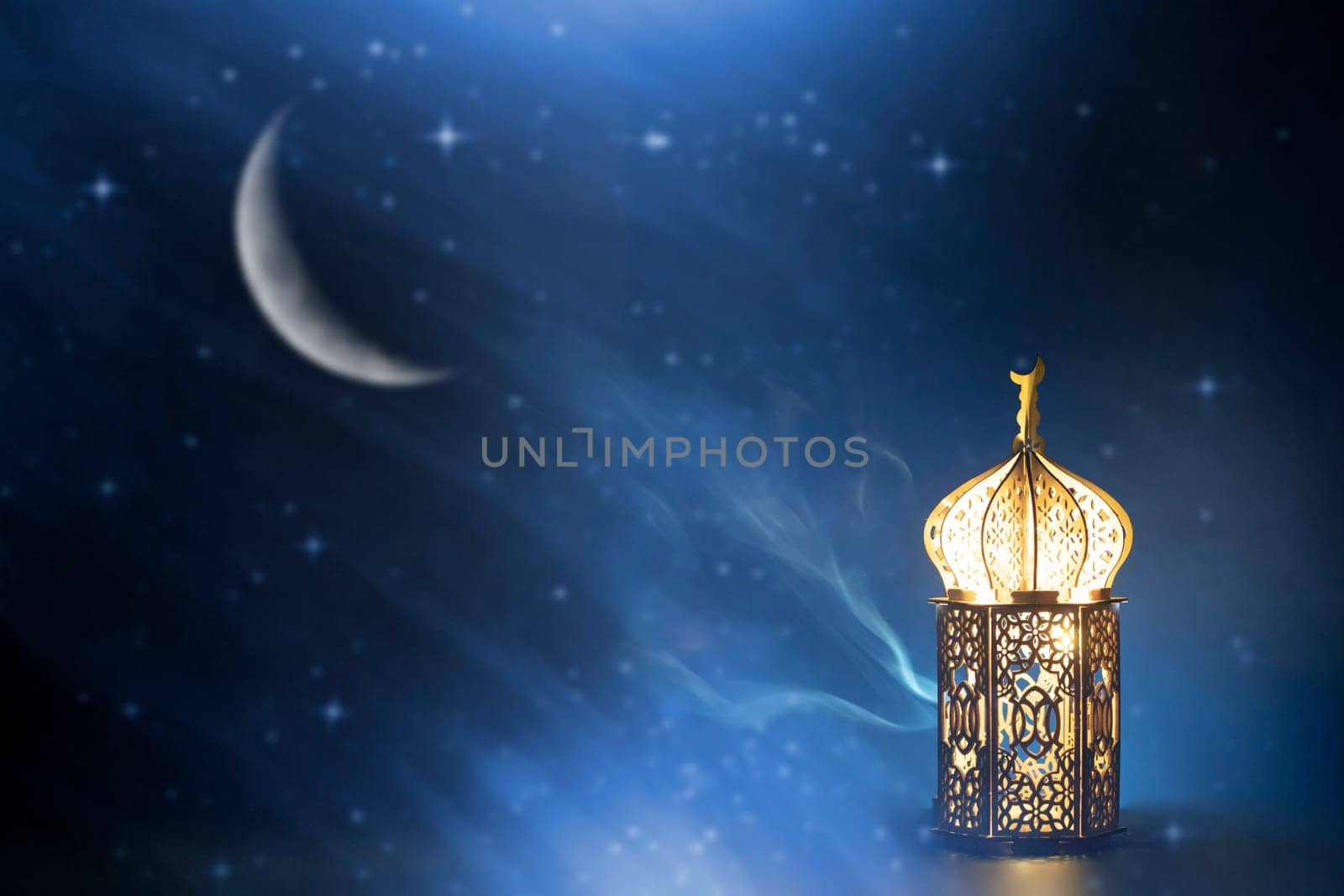 Ornamental Arabic lantern with crescent moon glowing at night. Festive greeting card for Muslim holy month Ramadan Kareem.