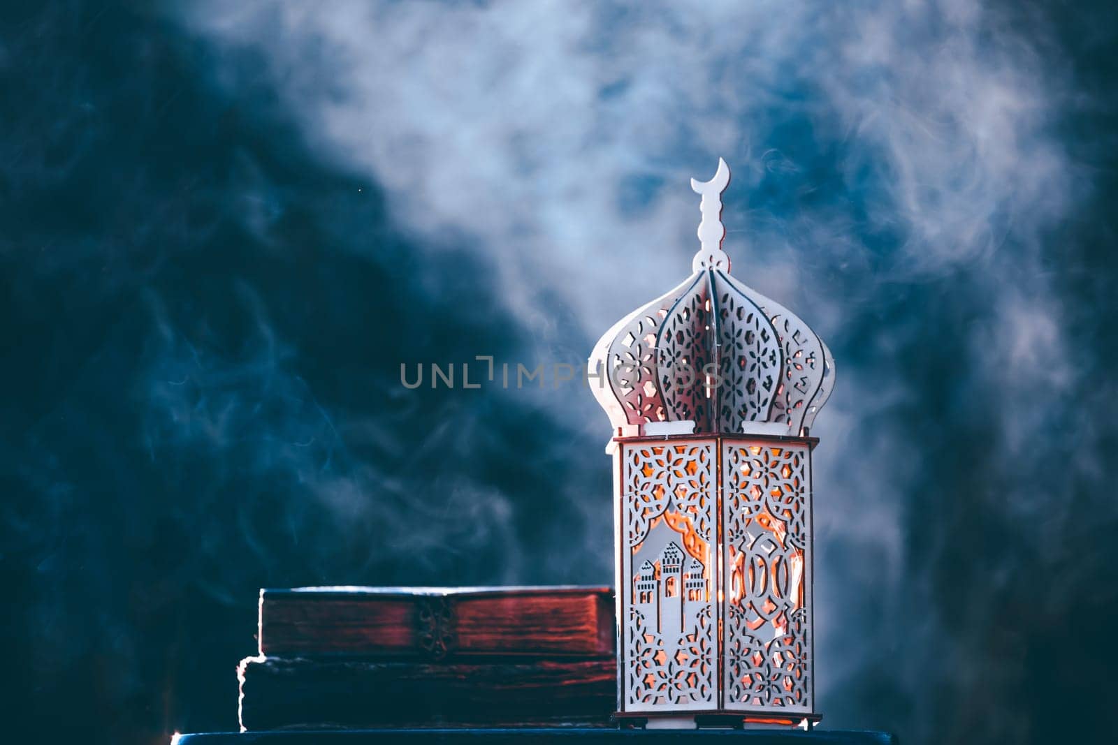 Ornamental Arabic lantern with with Holy Quran. Festive greeting card for Muslim holy month Ramadan Kareem.