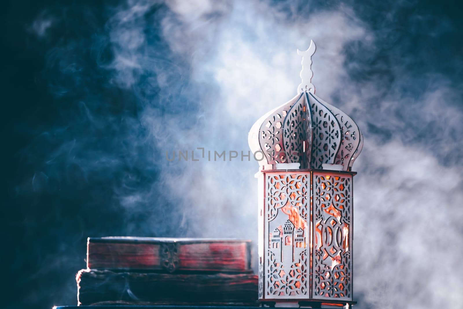 Ornamental Arabic lantern with with Holy Quran. Festive greeting card for Muslim holy month Ramadan Kareem.