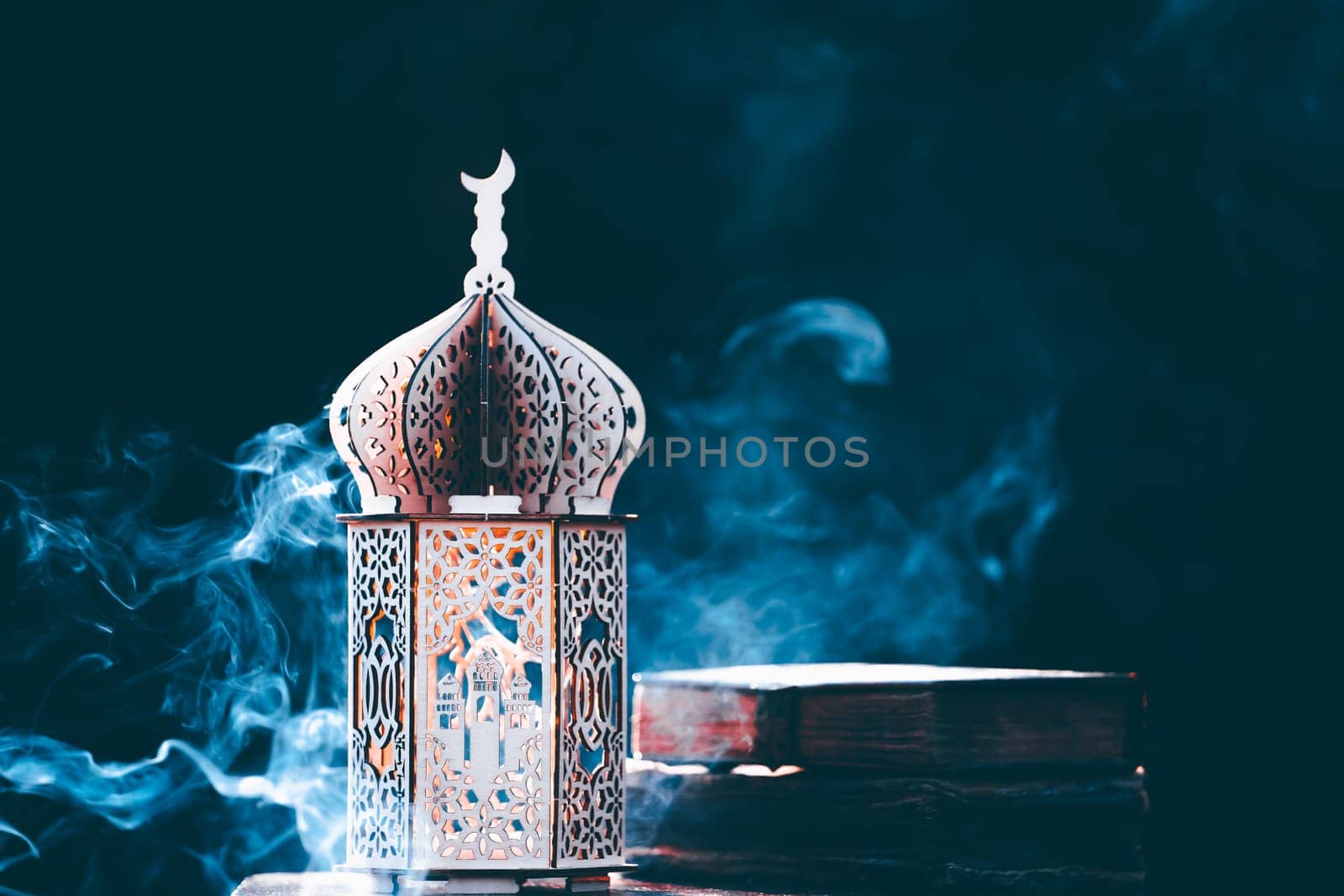 Ornamental Arabic lantern with with Holy Quran. Festive greeting card for Muslim holy month Ramadan Kareem.