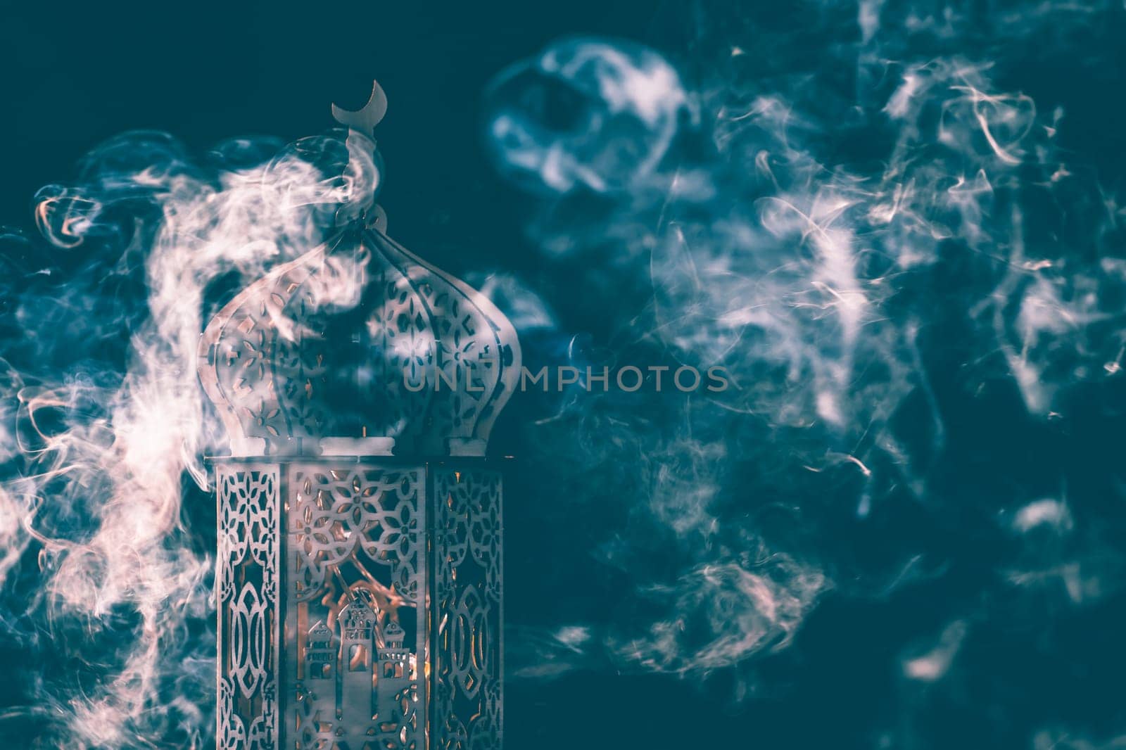 Ornamental Arabic lantern with smoke. Festive greeting card for Muslim holy month Ramadan Kareem.