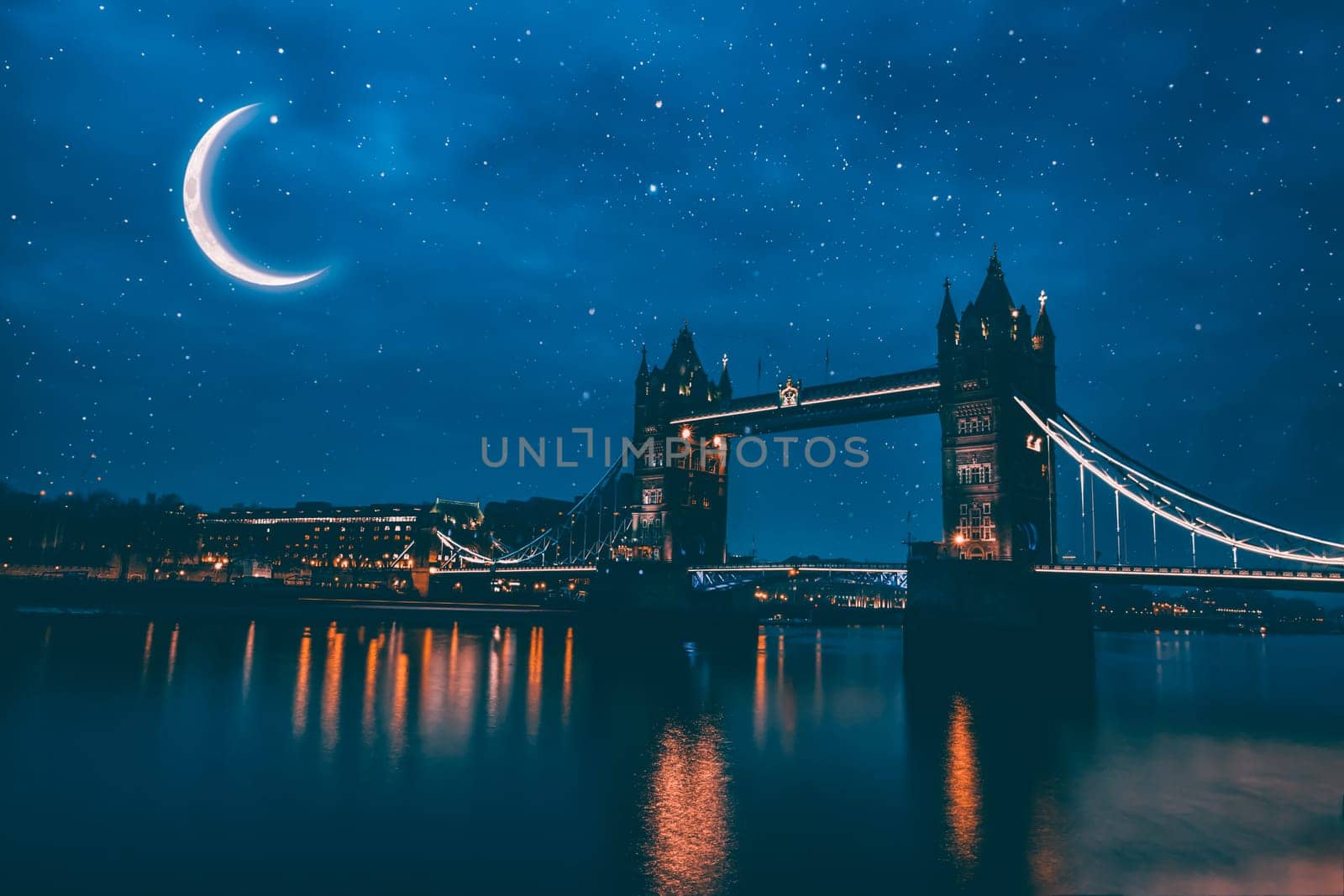 Illuminated Tower Bridge in London at night.