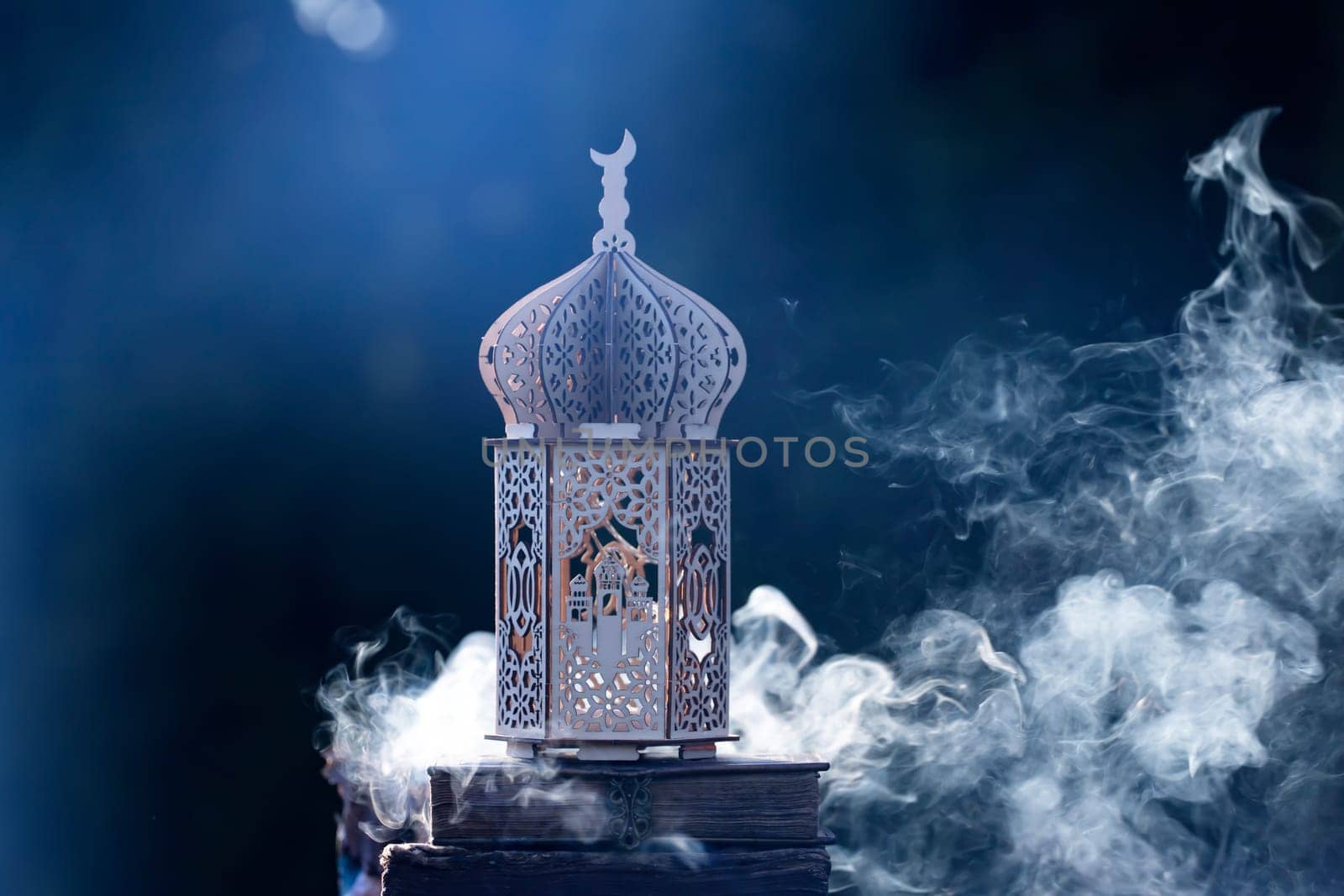 Ornamental Arabic lantern with with Holy Quran. Festive greeting card for Muslim holy month Ramadan Kareem.