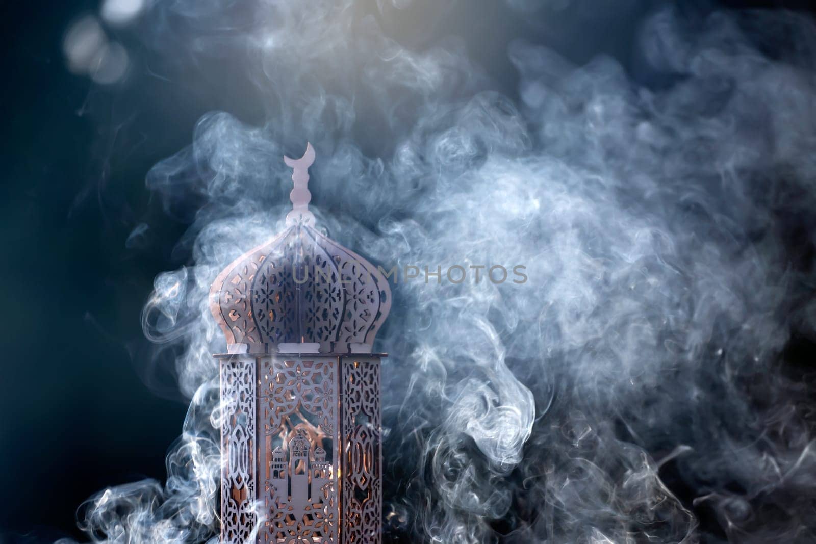 Ornamental Arabic lantern with smoke. Festive greeting card for Muslim holy month Ramadan Kareem.