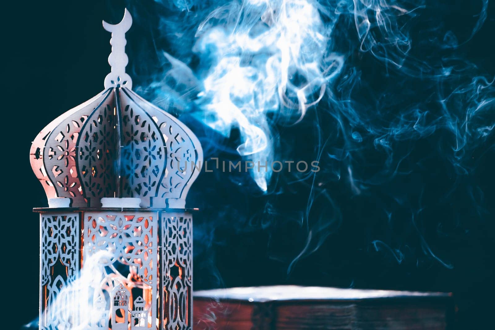 Ornamental Arabic lantern with with Holy Quran. Festive greeting card for Muslim holy month Ramadan Kareem.