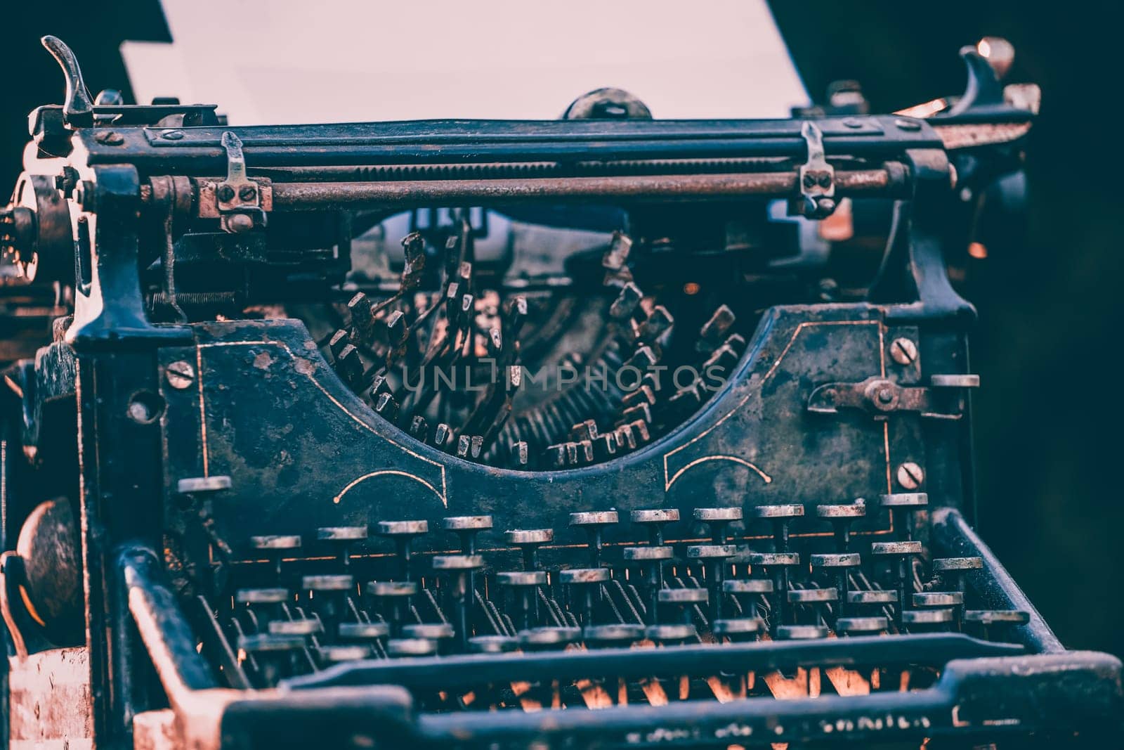 Antique typewriter. Vintage typewriter machine closeup photo.