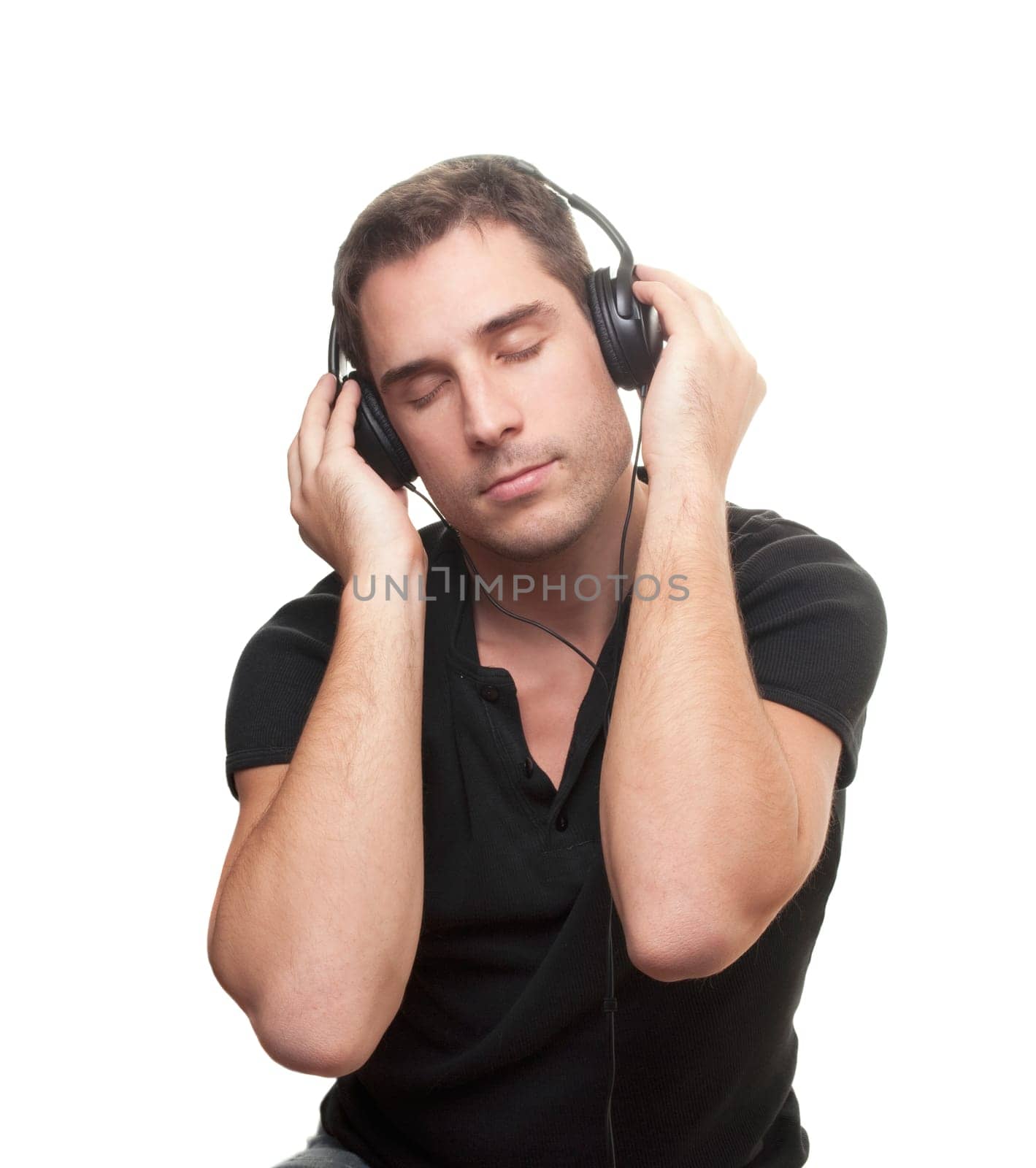 handsome man listening the music. Isolated over white background