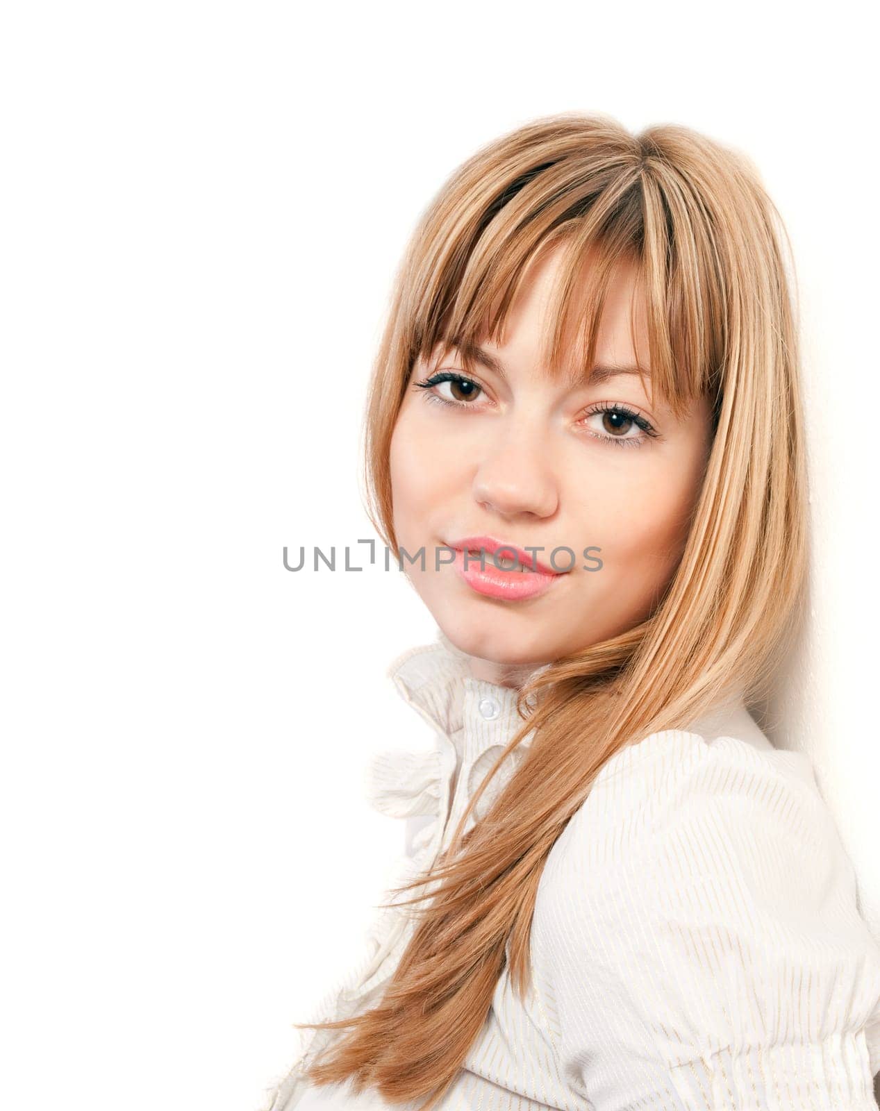 Portrait of beautiful young woman in white